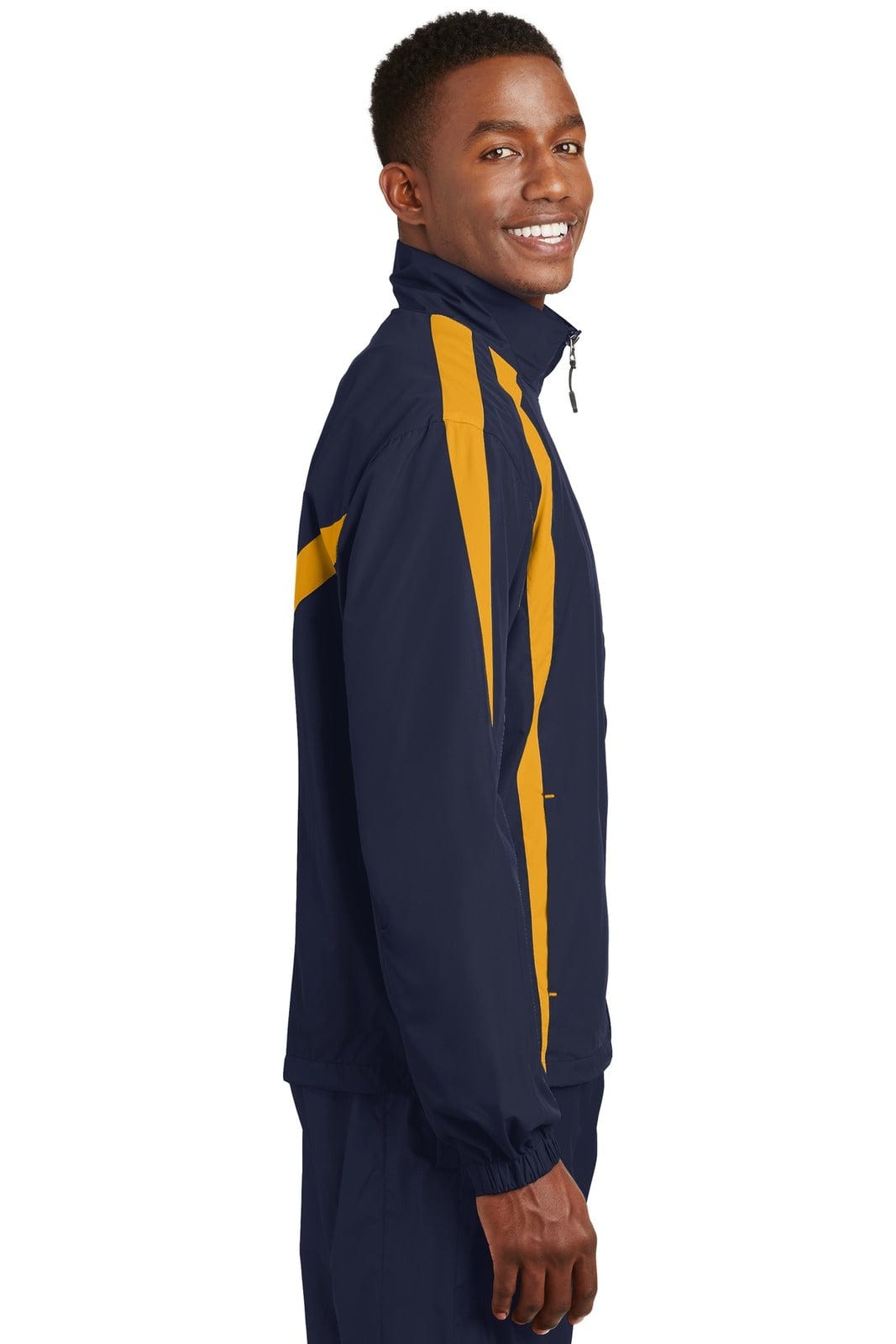 A model wearing a navy and gold Sport-Tek Colourblock Raglan Jacket featuring a logo. The jacket has a zip-up design.