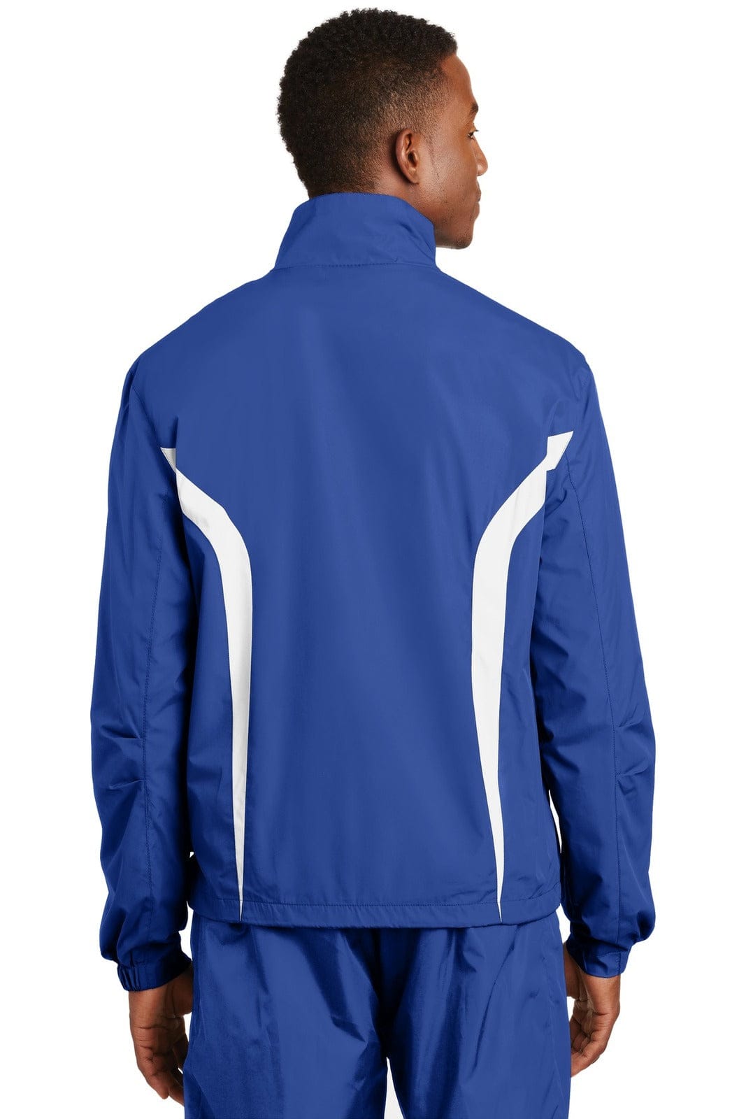 A blue Sport-Tek Colorblock Raglan Jacket with white accents, featuring a logo. View from the back.