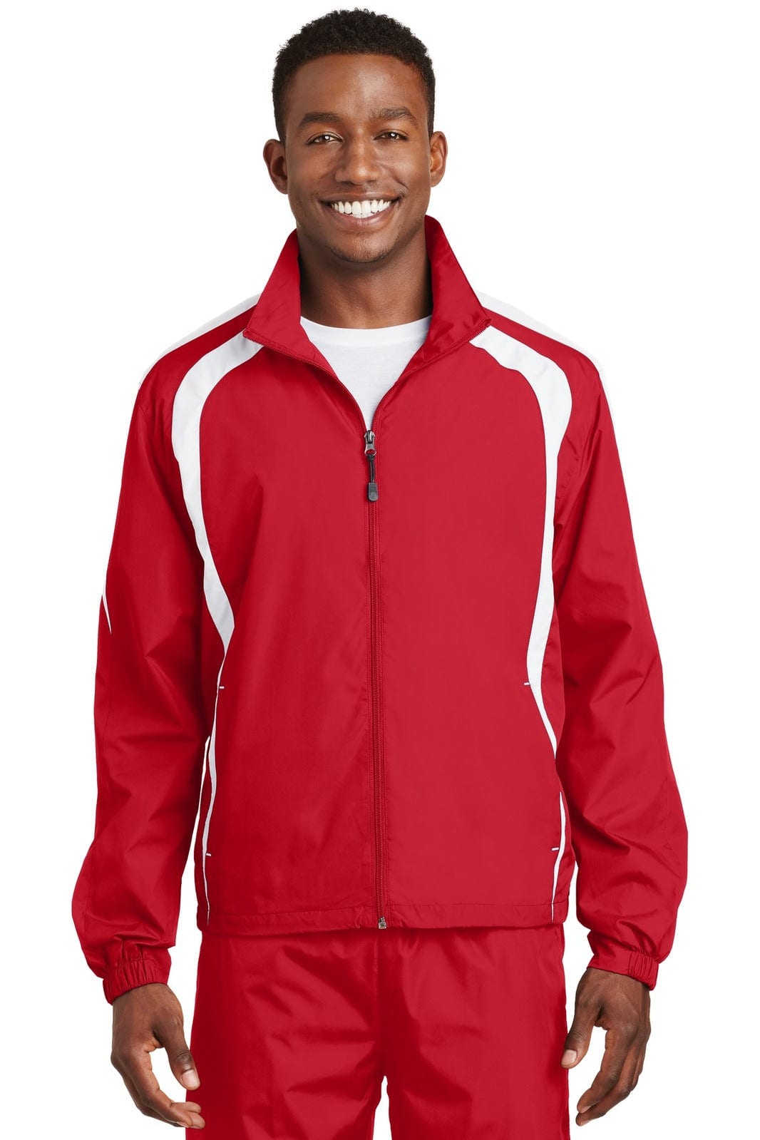 A red Sport-Tek Colorblock Raglan Jacket featuring white accents and a logo, designed as a track jacket.