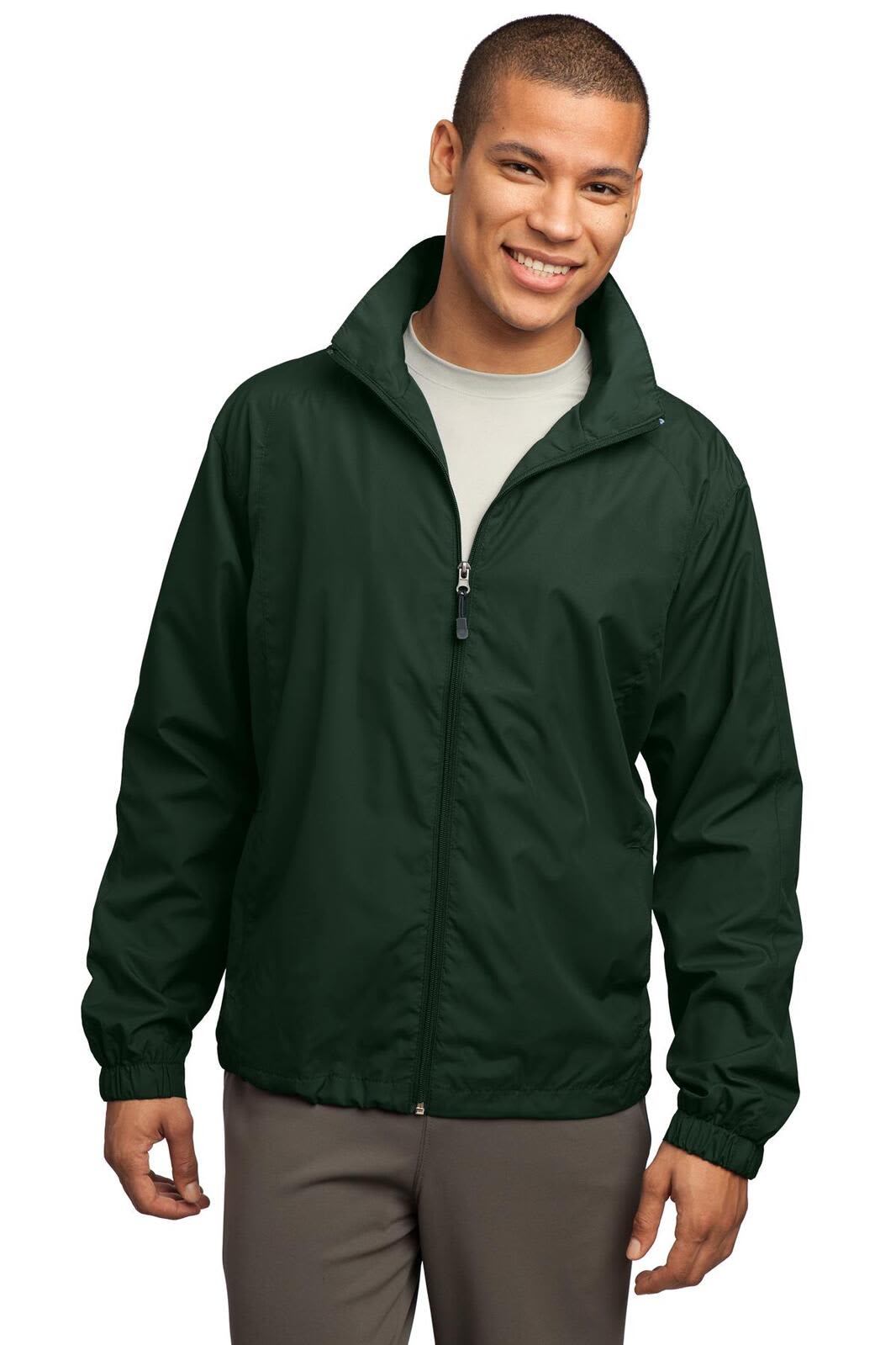 A man wearing a green Sport-Tek full-zip wind jacket, smiling and standing against a plain background.