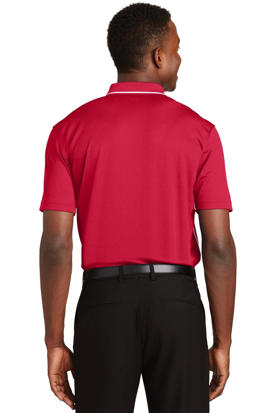 A red Sport-Tek Dri-Mesh polo shirt with a tipped collar and piping, worn by a person from the back.