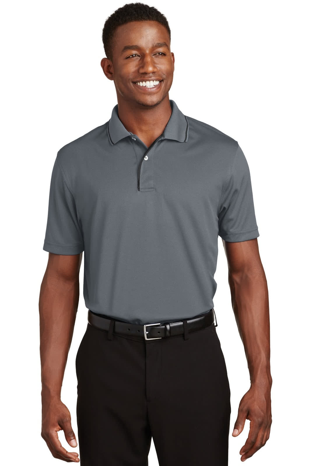 A grey Sport-Tek Dri-Mesh polo shirt with a tipped collar and piping, worn by a smiling male model.
