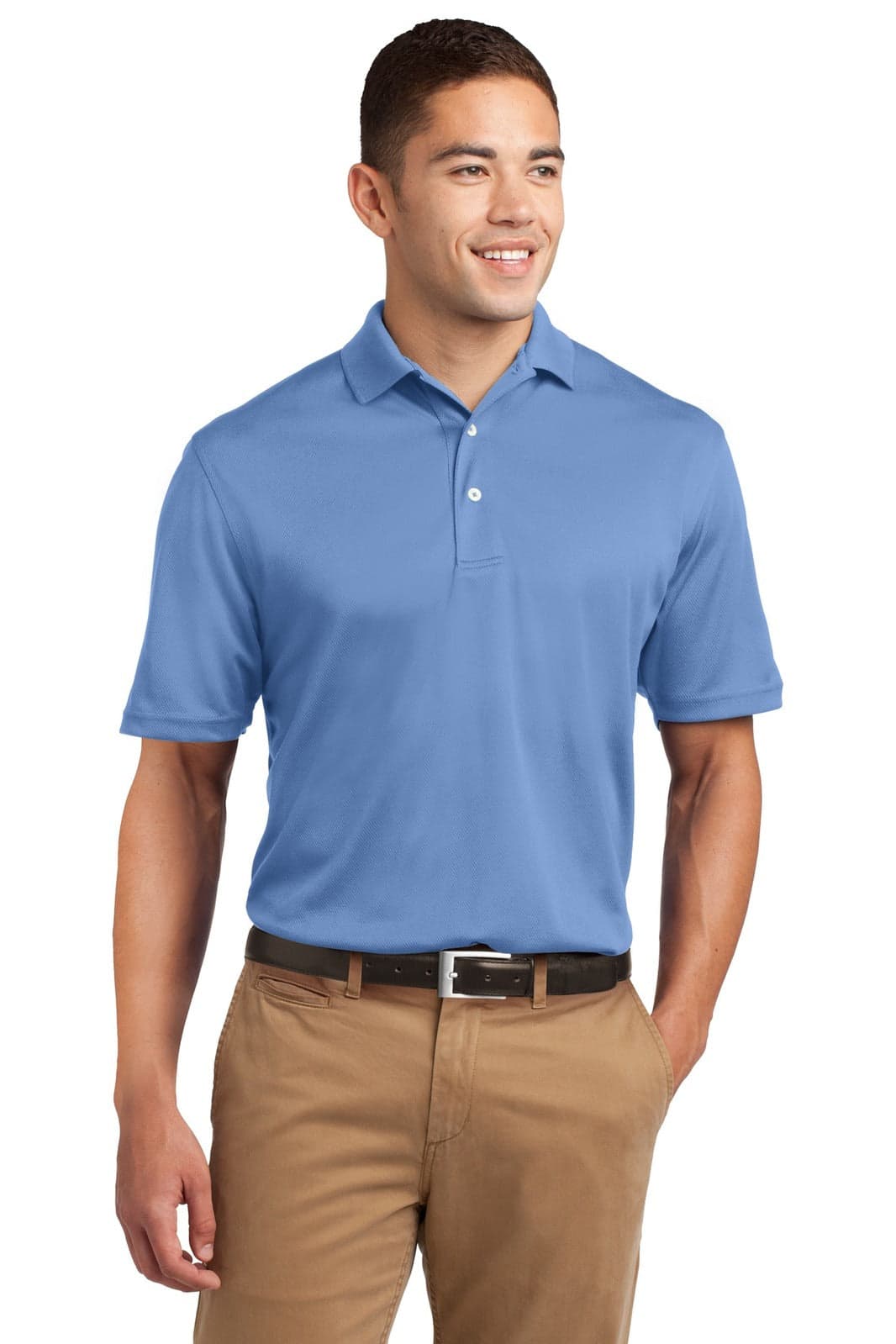 A man wearing a light blue Sport-Tek Dri-Mesh Polo shirt, with a logo on the chest, paired with tan trousers.