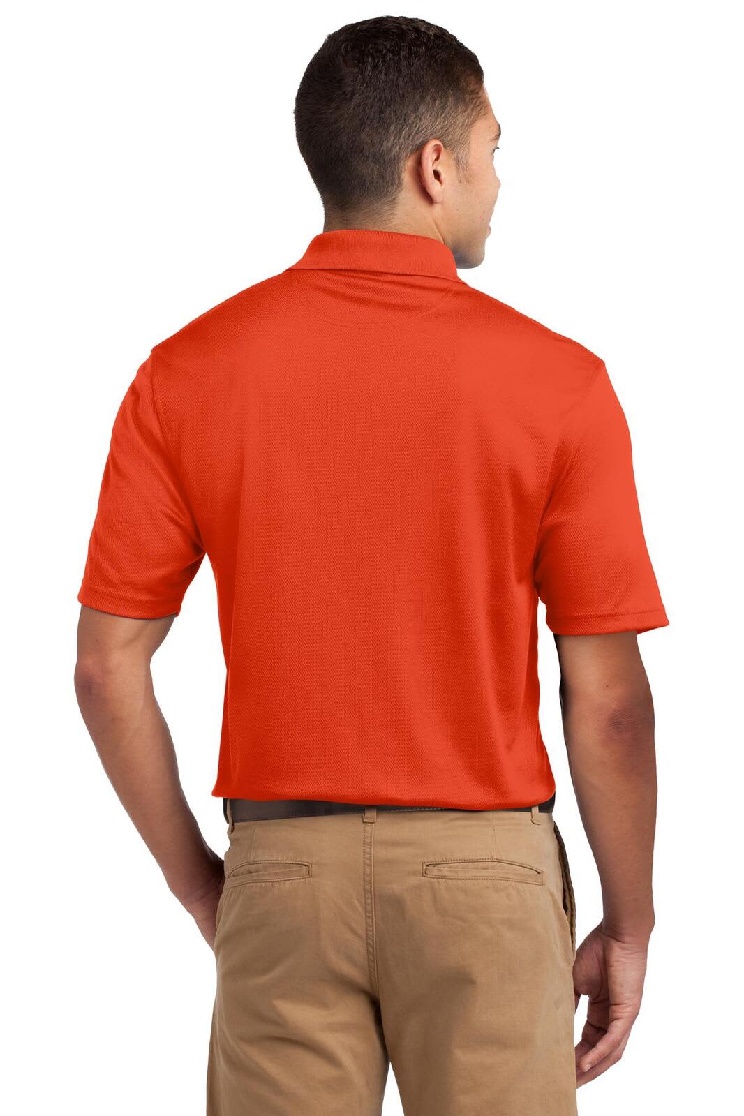 A man wearing an orange Sport-Tek Dri-Mesh Polo shirt, viewed from the back. The shirt features a logo.