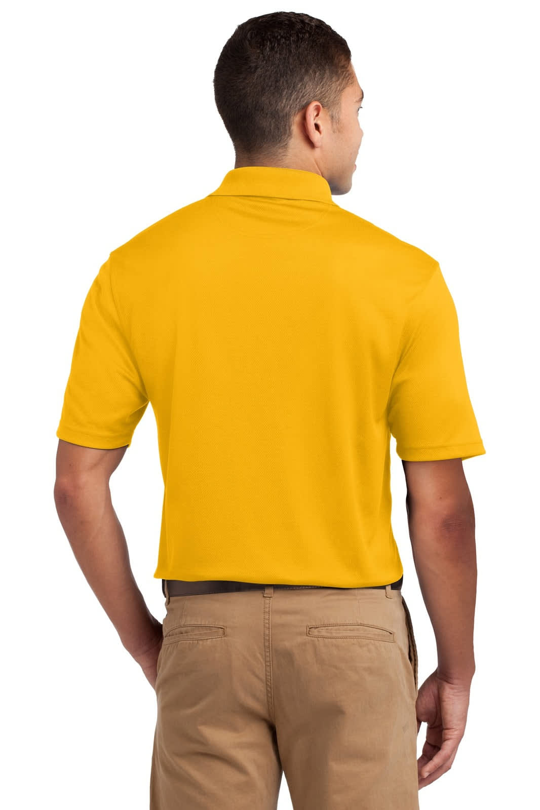 A man wearing a yellow Sport-Tek Dri-Mesh Polo from the back, paired with beige trousers. The shirt features a logo.