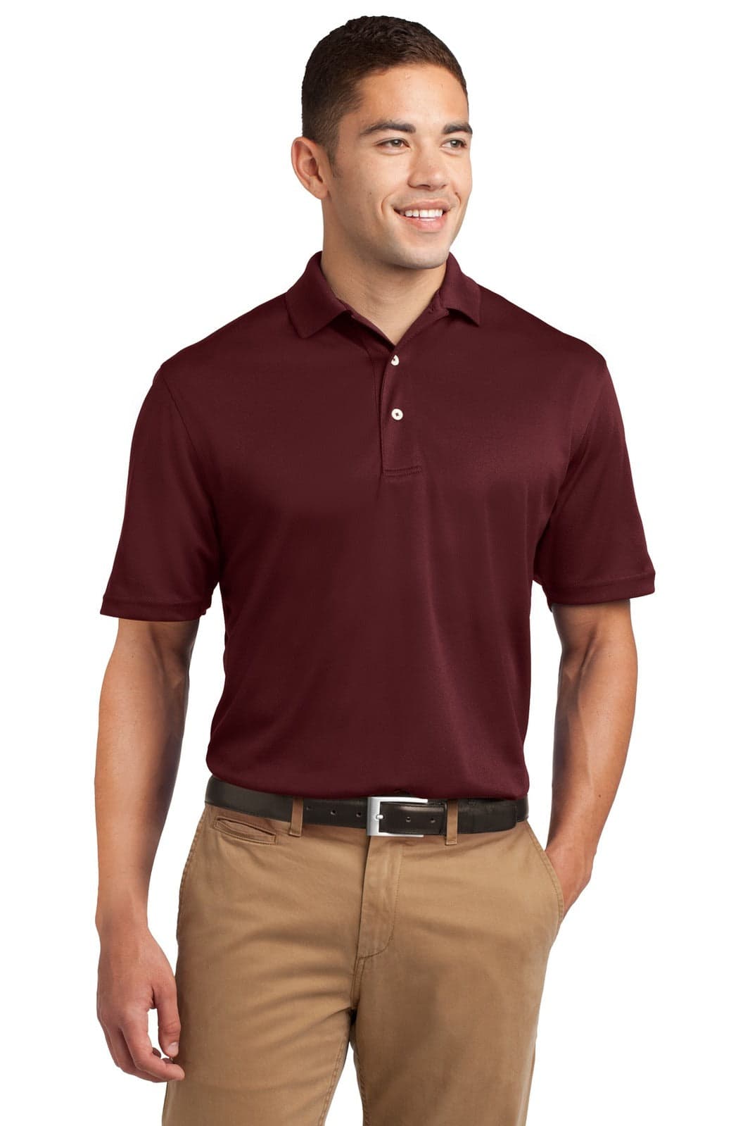 A maroon Sport-Tek Dri-Mesh polo shirt displayed on a smiling male model, featuring a collar and a logo.