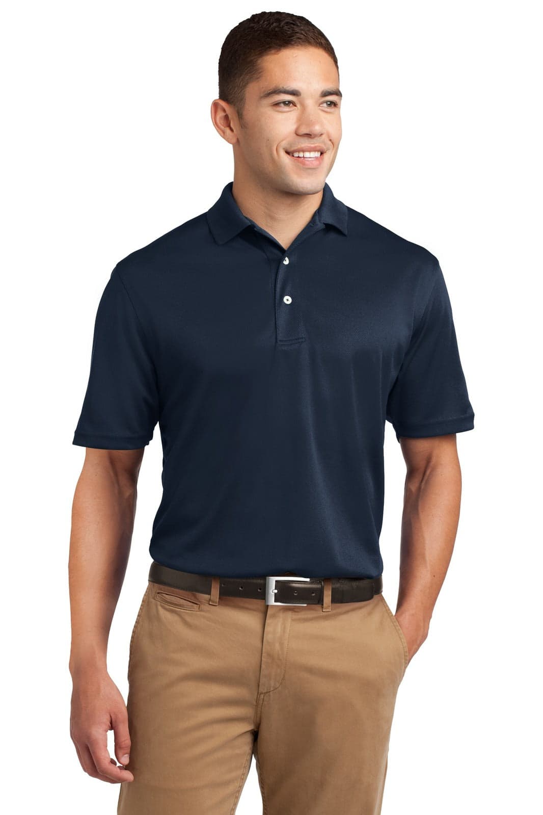 A navy polo shirt with a collar, featuring a logo, worn by a man standing with a smile.