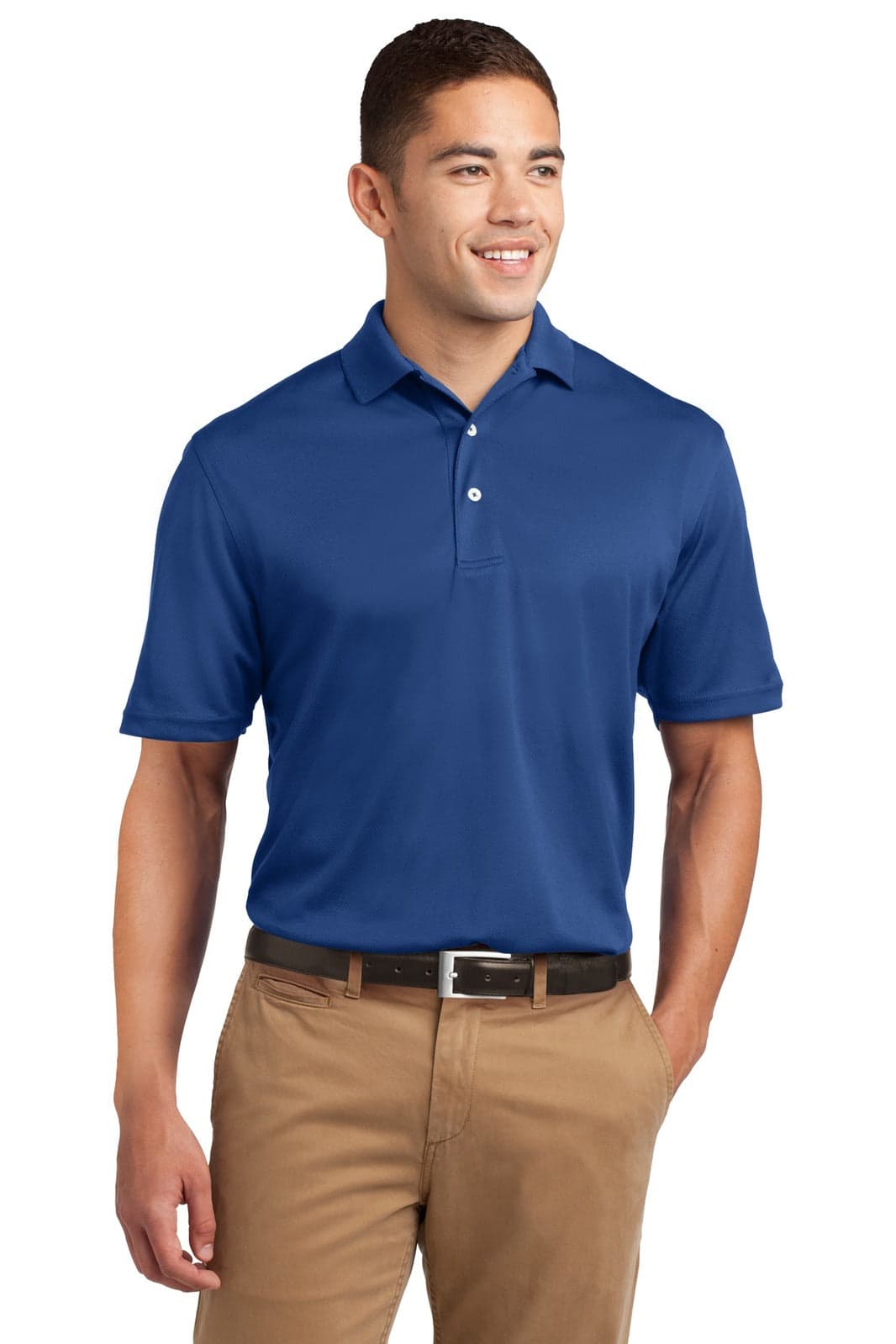A man models a blue Sport-Tek Dri-Mesh polo shirt, paired with beige trousers and a belt. The shirt has a logo.