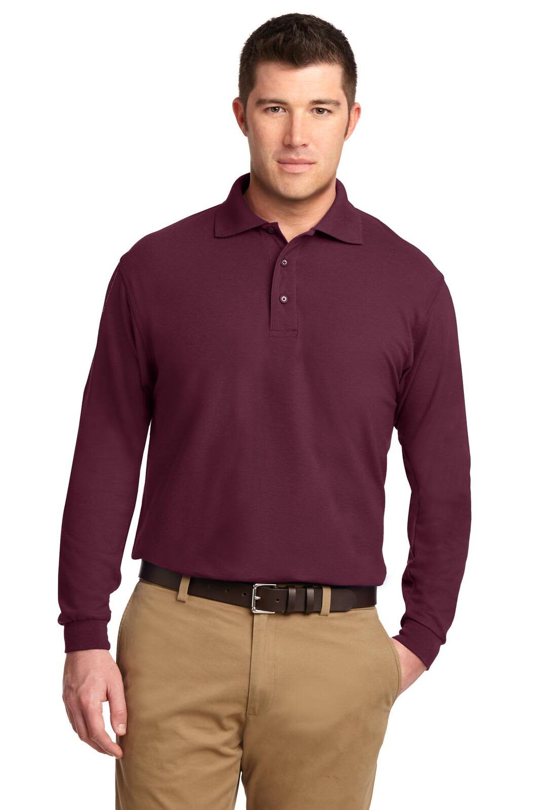 A long-sleeve polo shirt in burgundy, featuring a collar and a logo on the chest. Worn with khaki trousers.