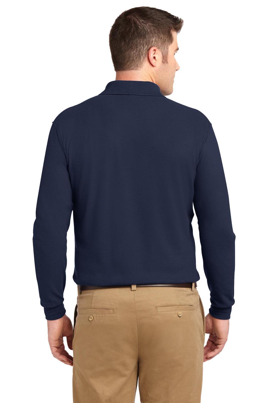A navy long sleeve polo shirt with a collar, featuring a logo on the back, worn with khaki trousers.