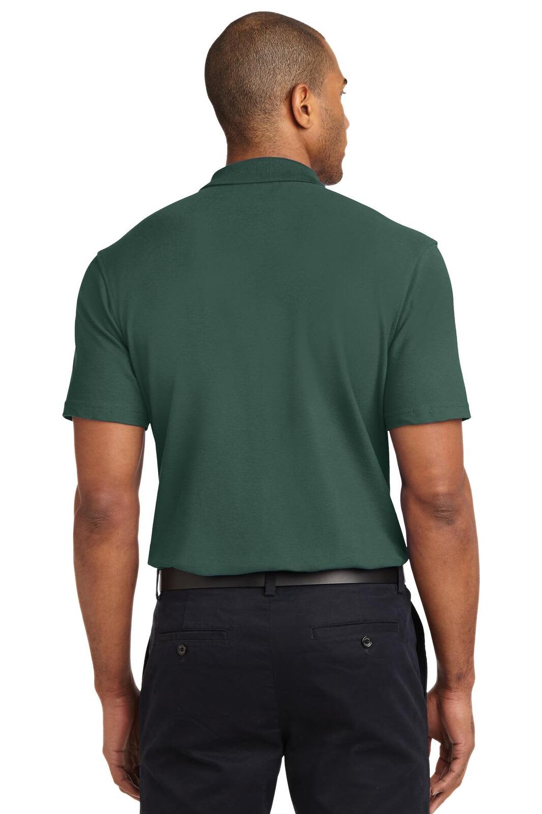 A green stain-resistant polo shirt displayed from the back, featuring a logo on the upper back.