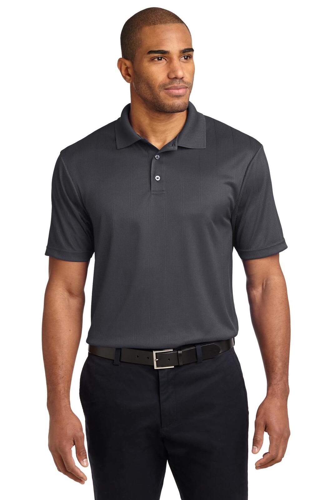 A grey performance fine jacquard polo shirt on a model, featuring a logo and paired with black trousers.