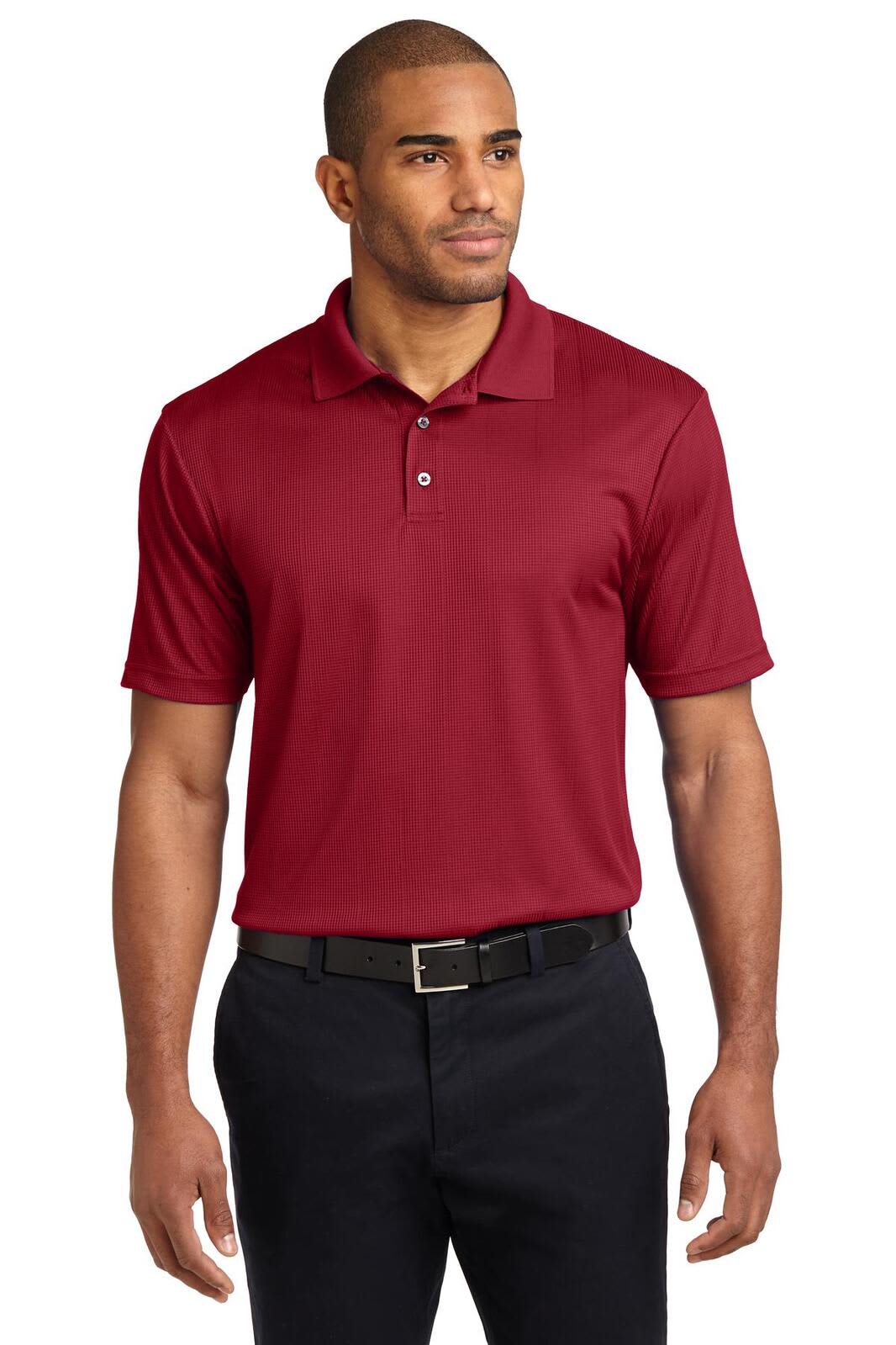 A maroon polo shirt with a collar, short sleeves, and a logo on the chest. A model is wearing the shirt.