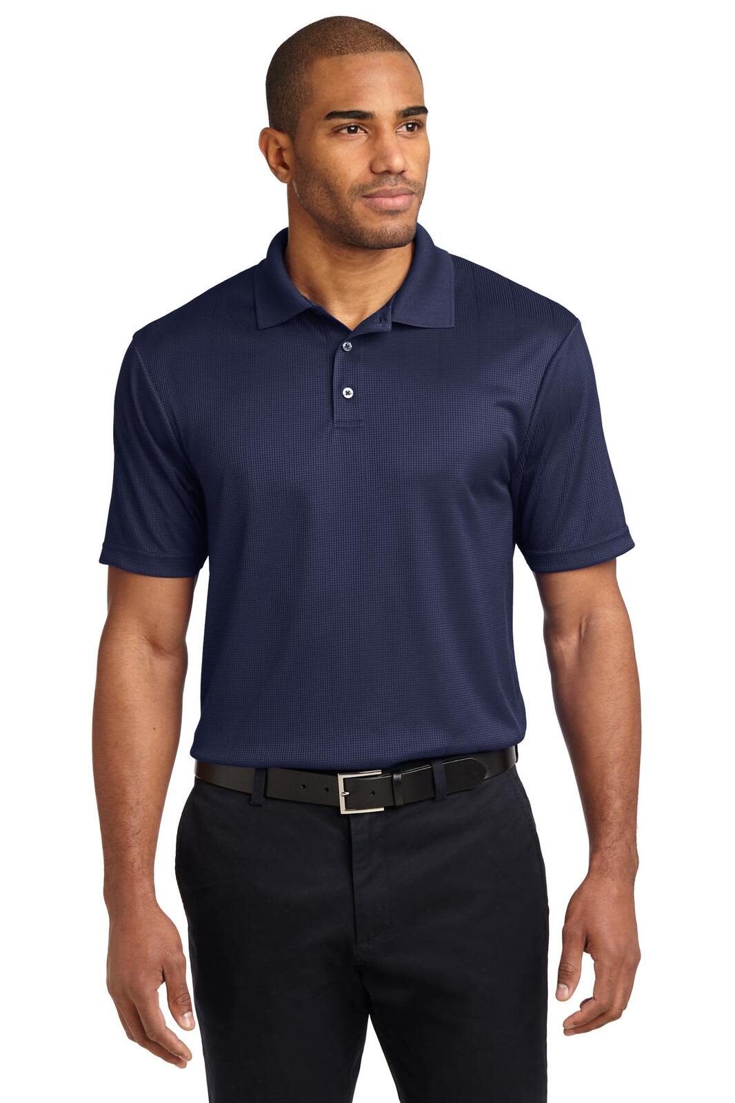 A navy polo shirt is displayed on a model, featuring a collar, buttons, and a logo. Paired with black trousers.