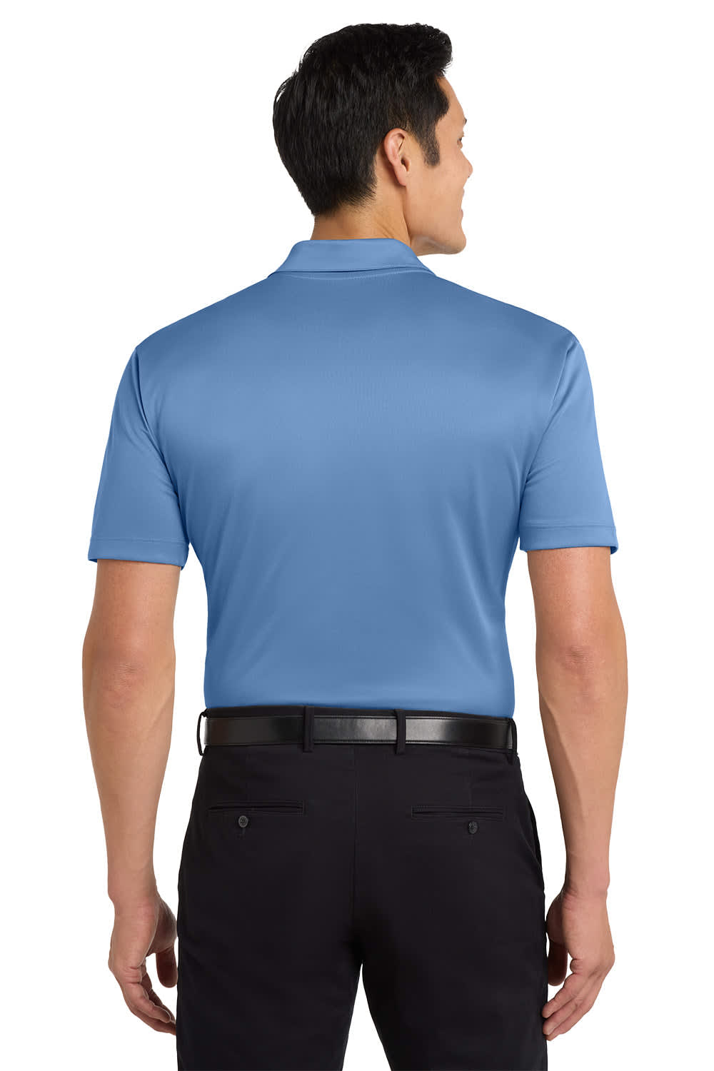 A man wearing a light blue polo shirt, viewed from the back, with a logo on the shirt.
