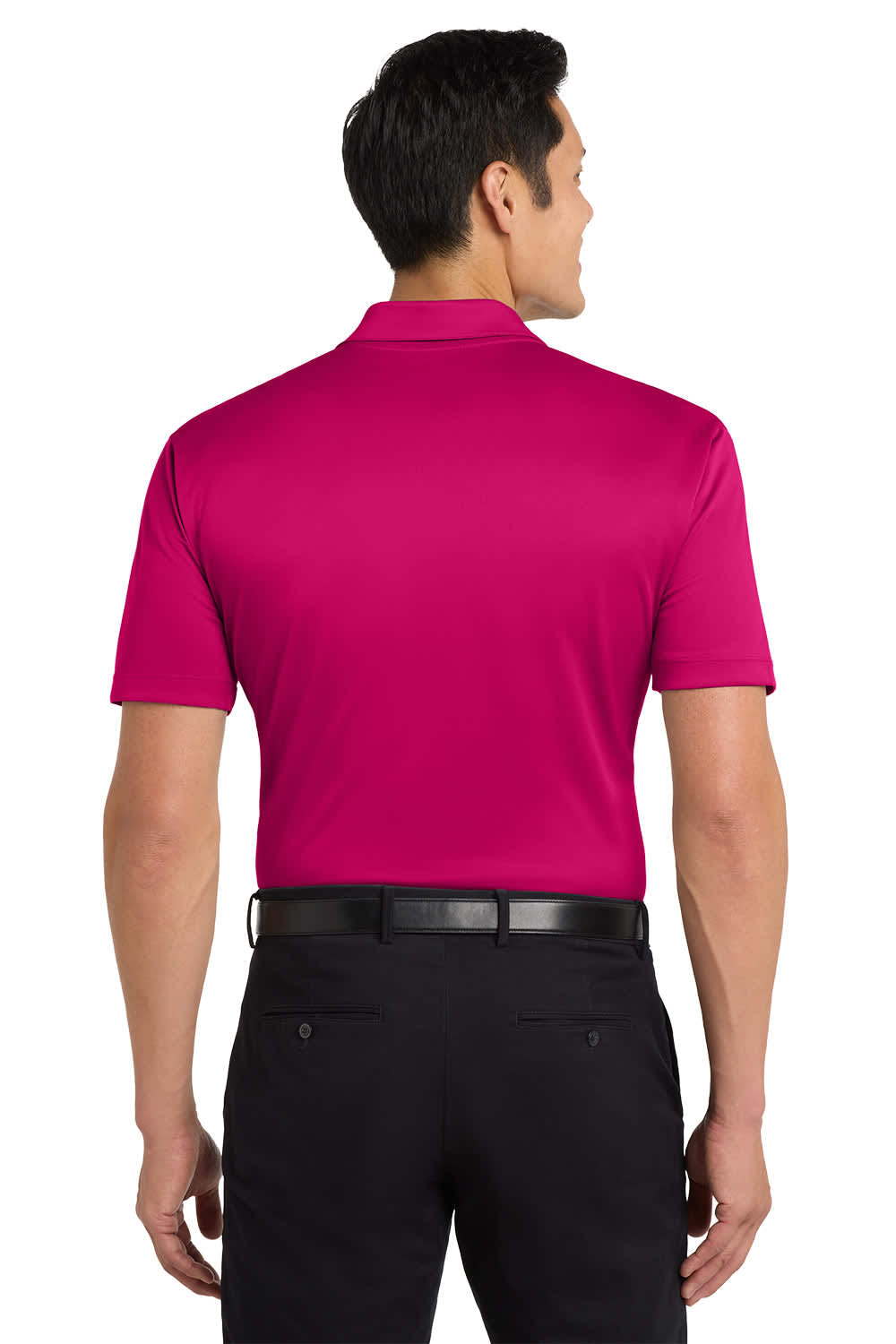 A man wearing a bright pink Port Authority Silk Touch Performance Polo from the back, paired with black trousers.