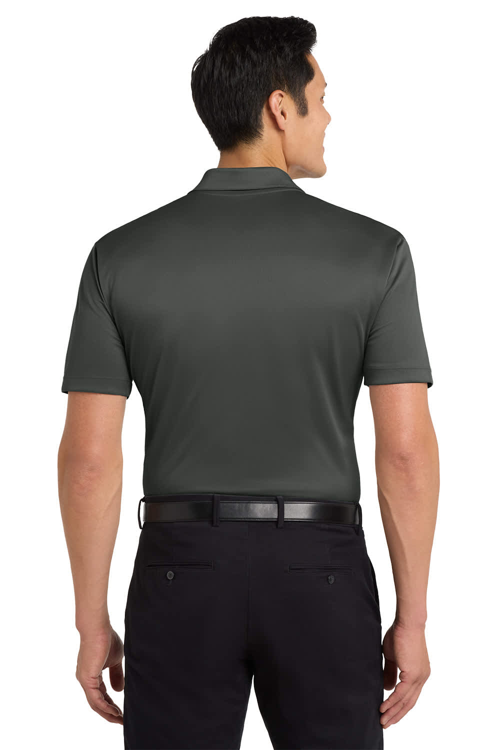 A man wearing a dark green polo shirt, viewed from the back, paired with black trousers. The shirt features a logo.