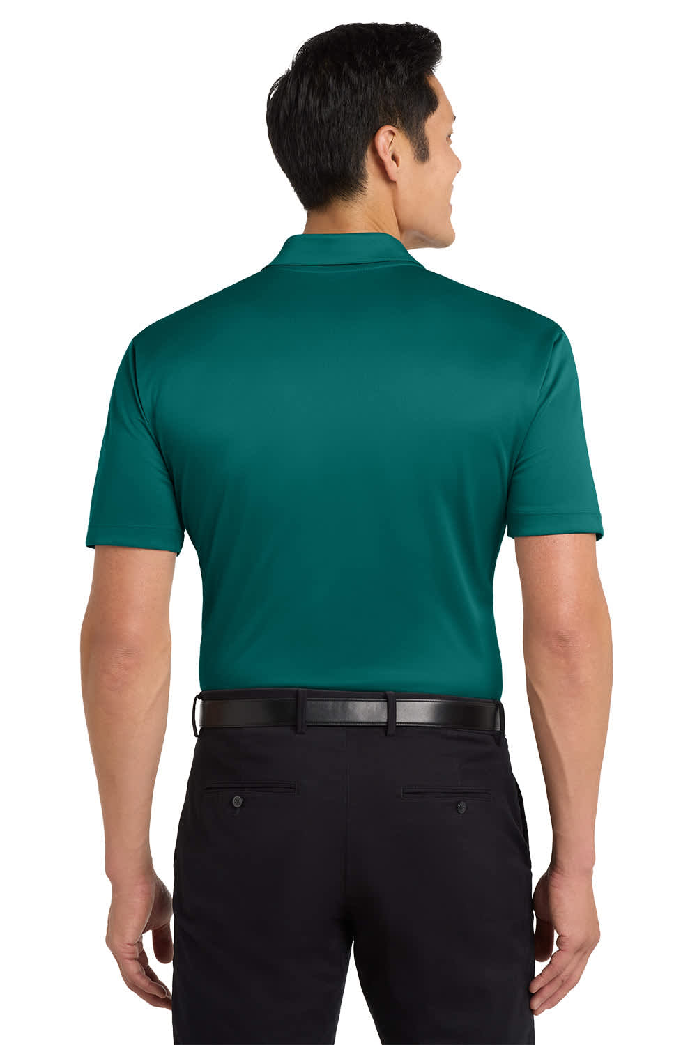 A man wearing a green polo shirt, viewed from the back, paired with dark pants. The shirt features a logo.