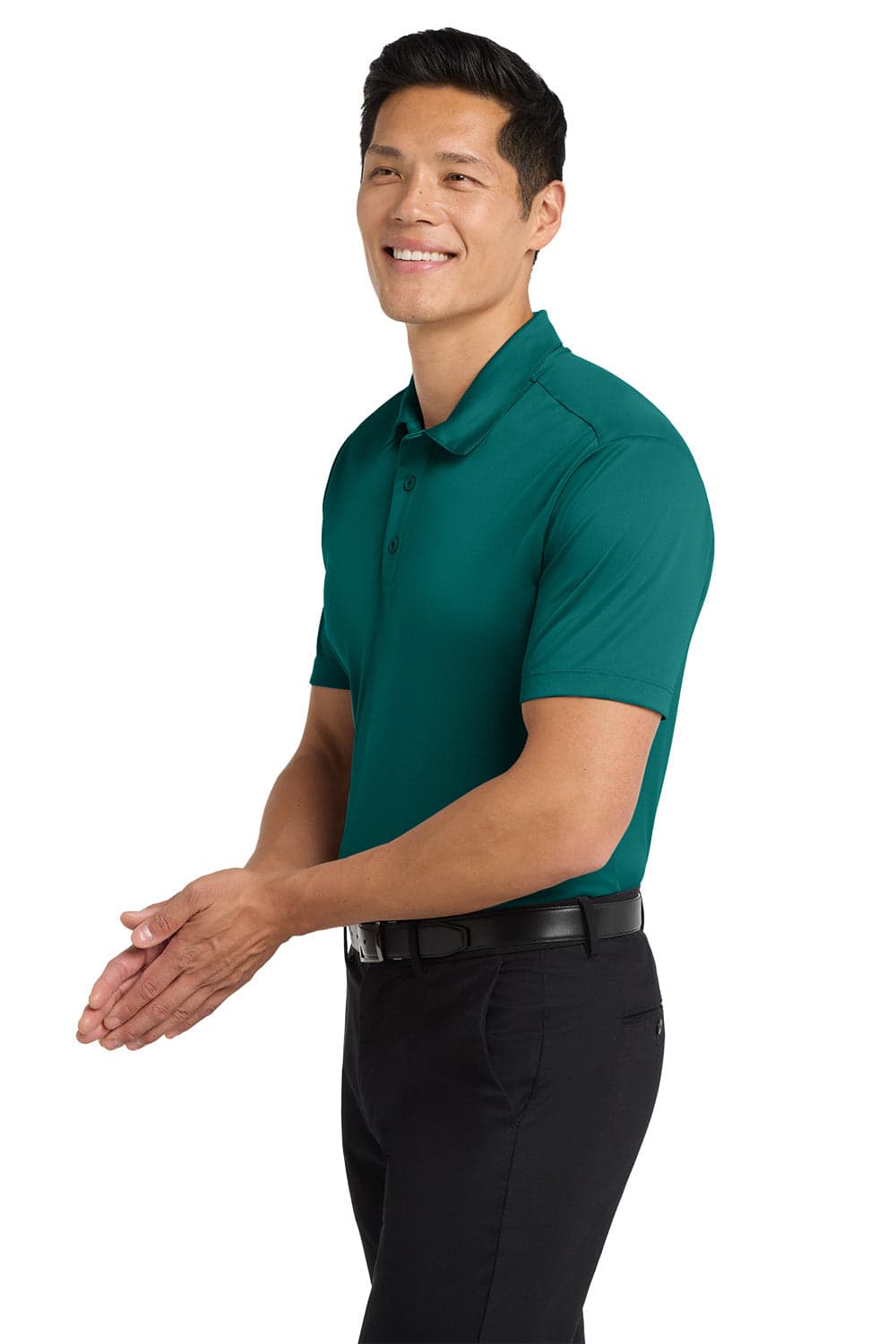 A teal polo shirt on a model, featuring a logo, paired with black trousers.