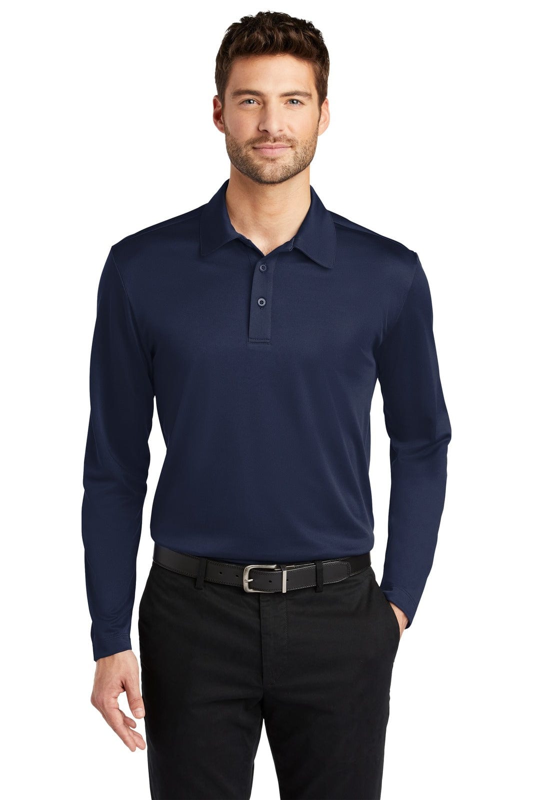 A man wearing a navy long sleeve polo shirt, paired with black trousers. The shirt features a logo.