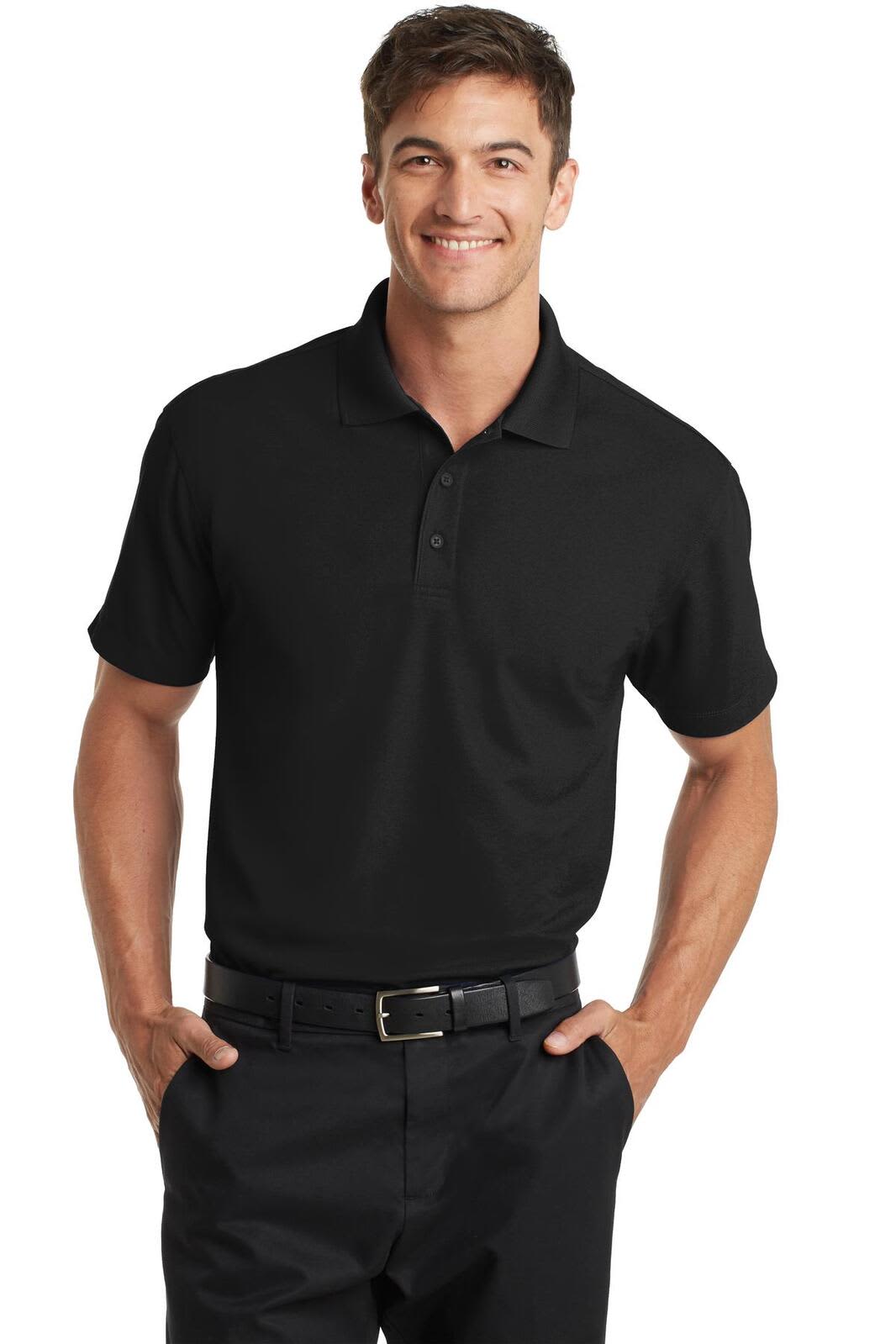 A black polo shirt with short sleeves, featuring a collar and a brand logo. The model is wearing it with black trousers.