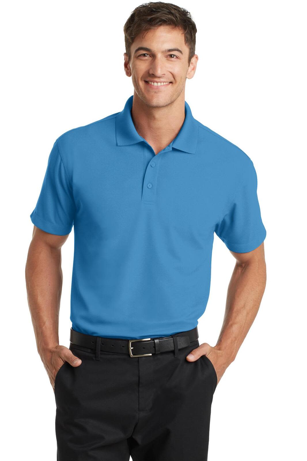 A man wearing a short-sleeved polo shirt in blue, with a collar and a logo, paired with black trousers.