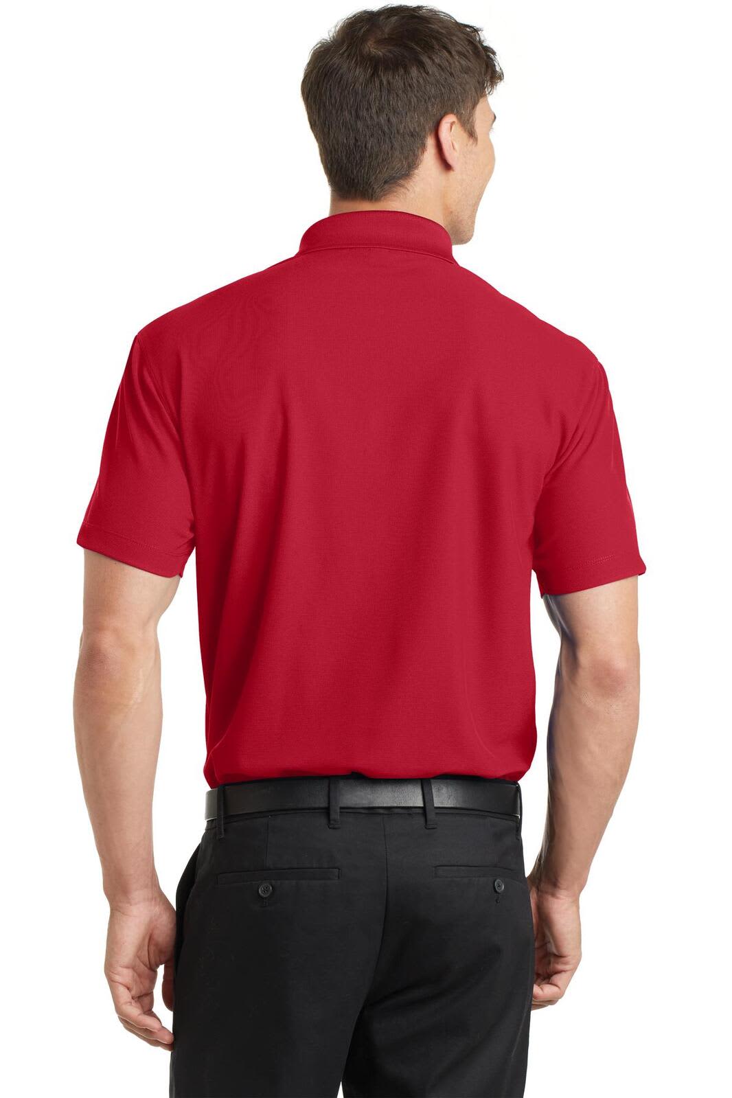 A red polo shirt featuring a collar and short sleeves, shown from the back with a visible logo.