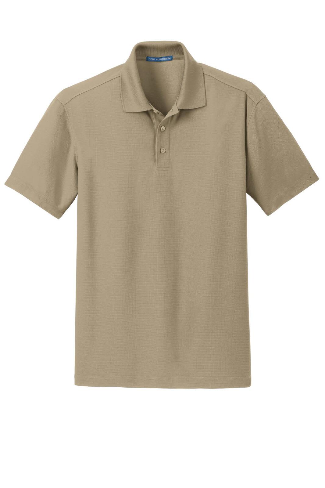 A beige Port Authority Dry Zone Grid Polo shirt with a collar and three buttons, featuring a logo.