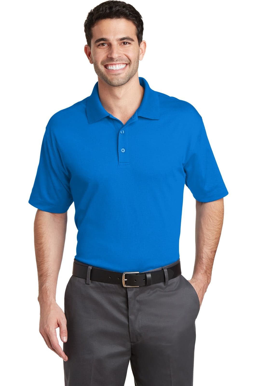 A blue polo shirt with a collar, short sleeves, and a logo, worn by a smiling man with dark hair.