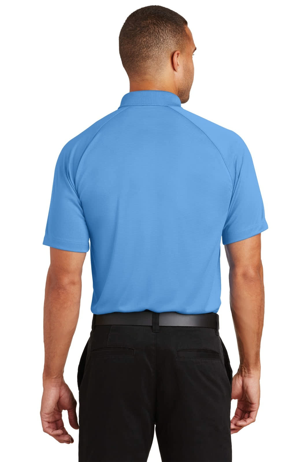 A back view of a light blue Port Authority Crossover Raglan Polo shirt with a logo. Suitable for casual wear.