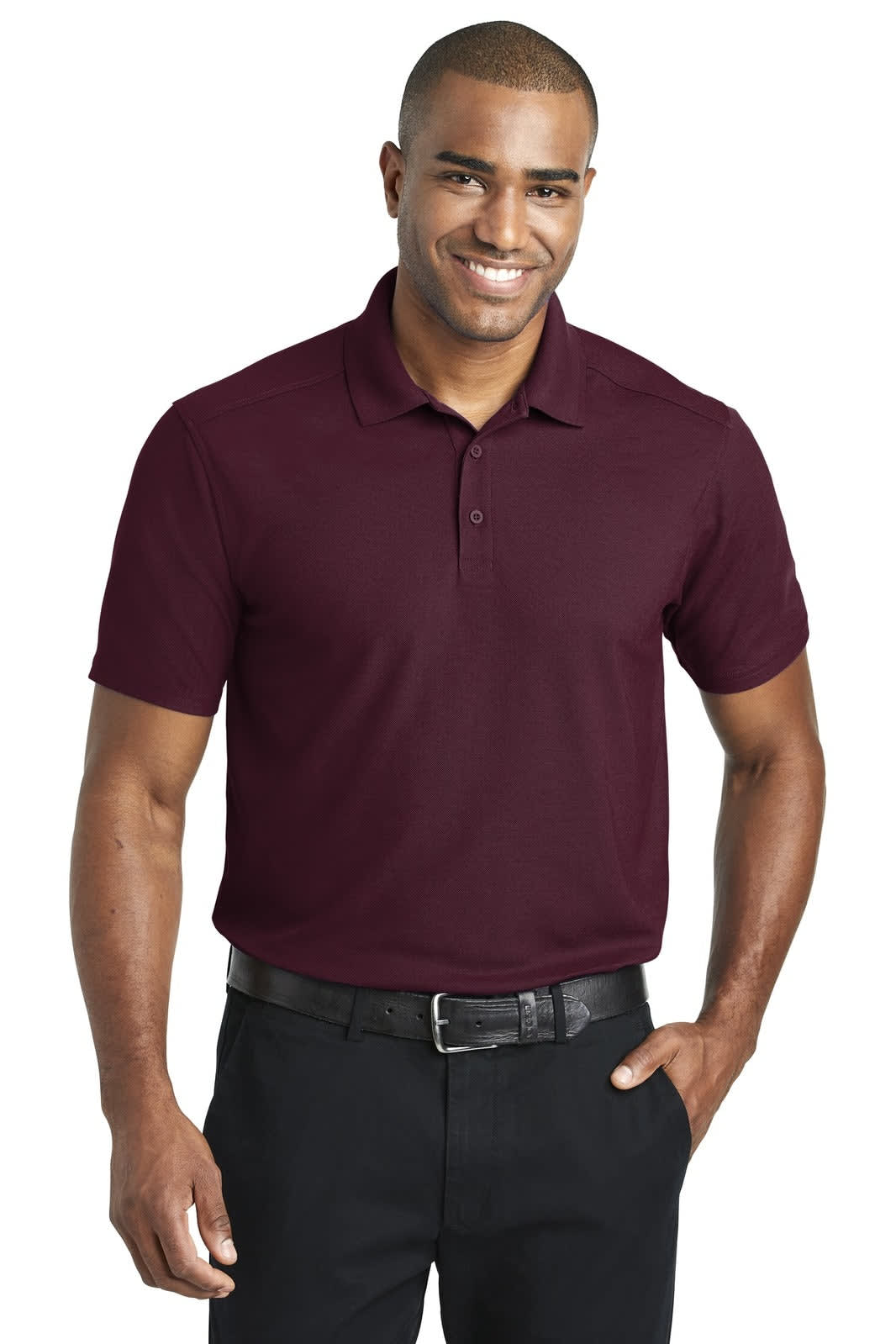 A maroon polo shirt with a collar and short sleeves, featuring a logo on the chest. Worn by a smiling male model.