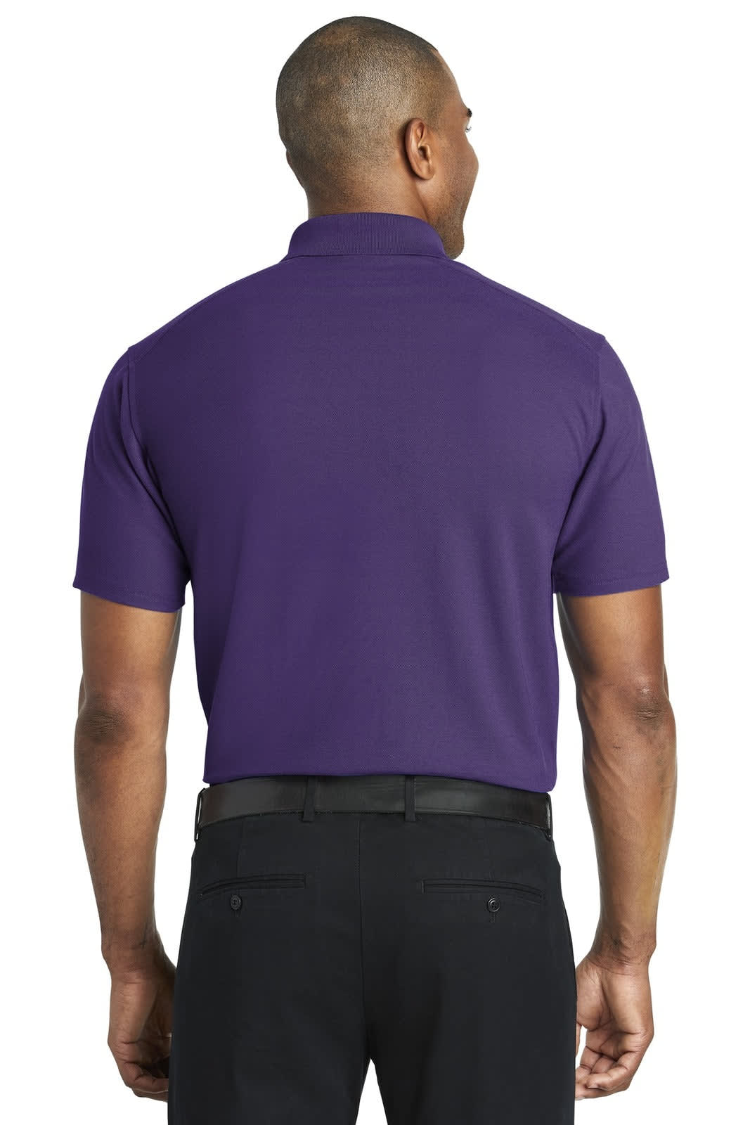 A purple polo shirt viewed from the back, featuring short sleeves and a collar. The model wears black trousers.