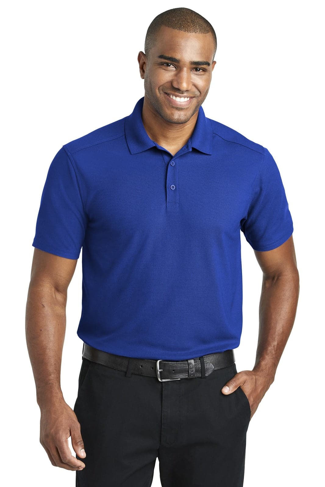 A blue polo shirt is worn by a smiling man, featuring a collar and short sleeves, with a logo on the chest.