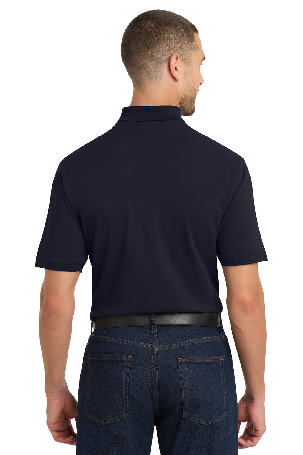 A man wearing a navy polo shirt, viewed from the back, featuring short sleeves and a collar. The shirt has a logo.