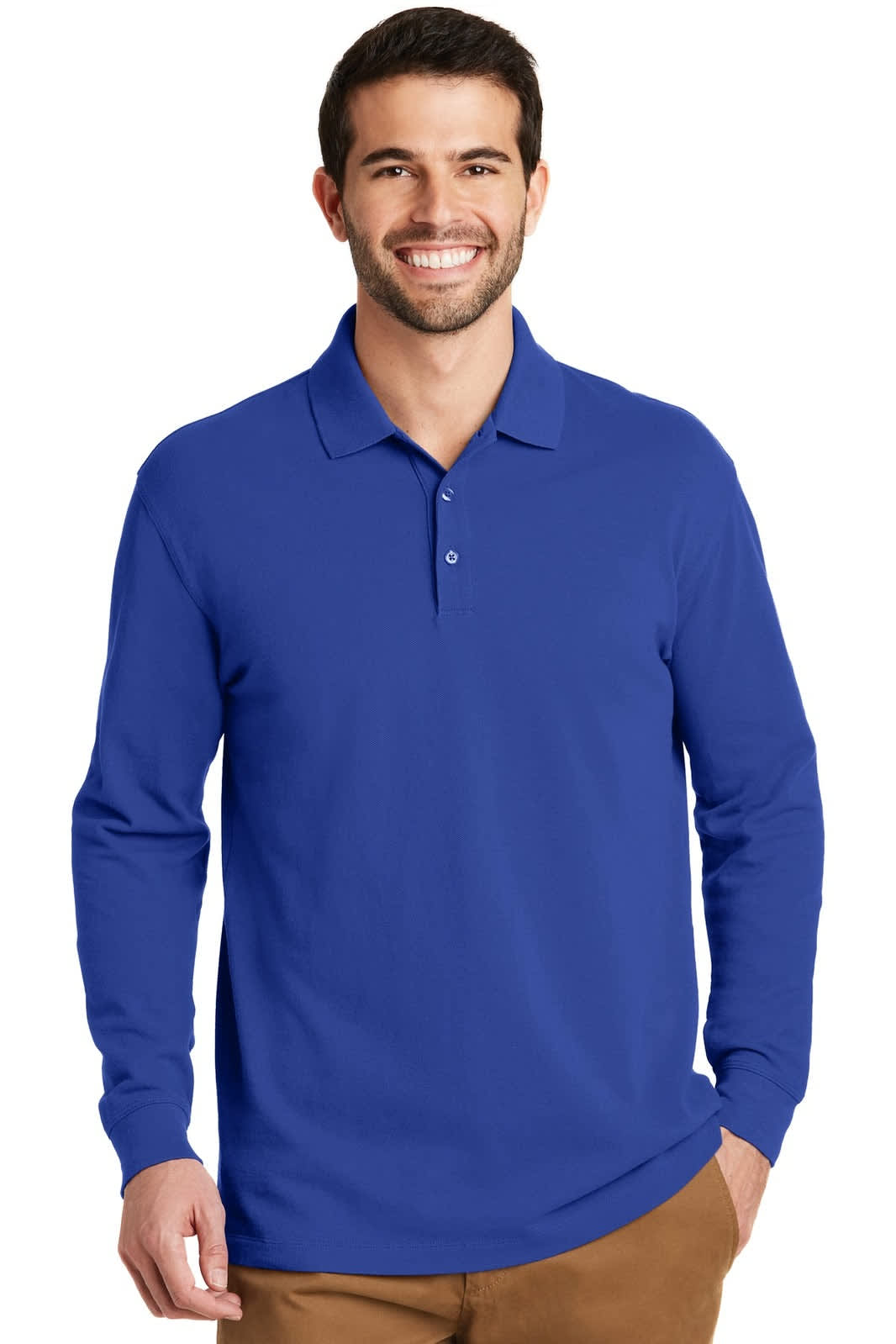 A man is wearing a long sleeve, royal blue polo shirt. The shirt has a logo on it.