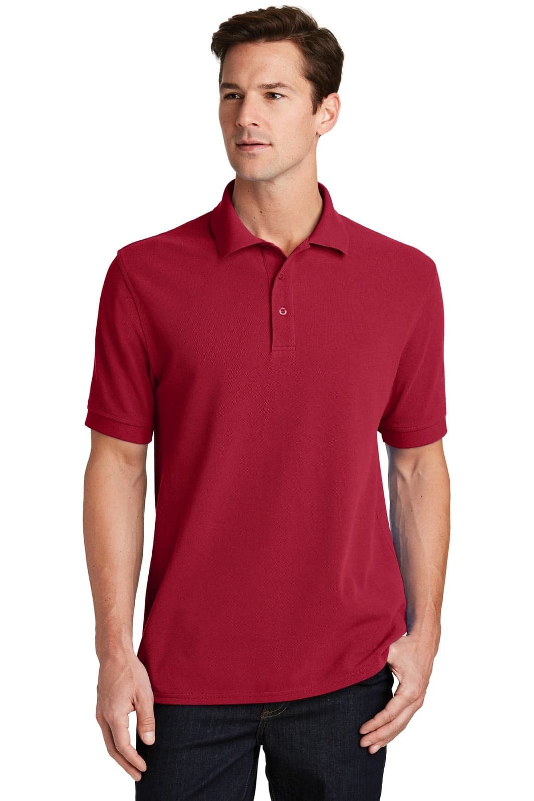 A red polo shirt made from ring-spun pique fabric, featuring a collar and a logo.