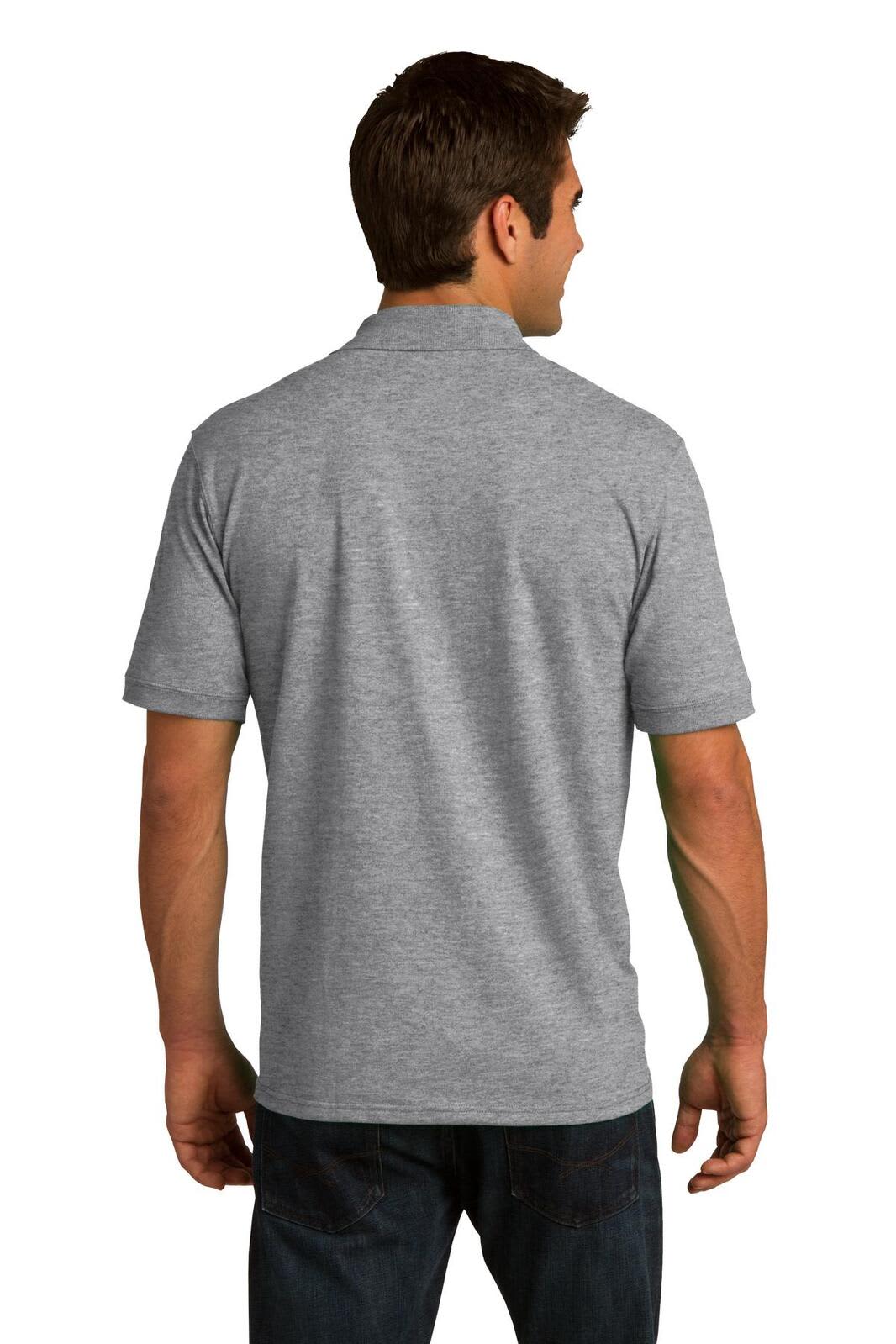 A man wearing a grey Port & Company Core Blend Jersey Knit Polo, viewed from the back. The polo features a logo.