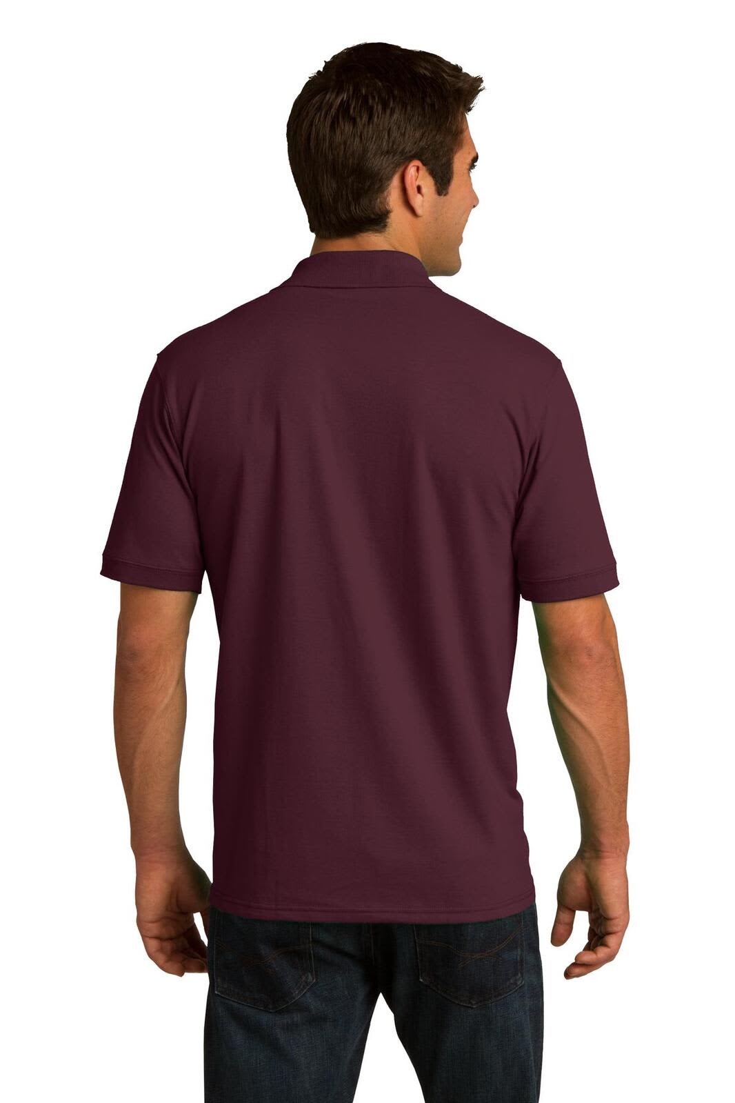 A maroon Port & Company Core Blend Jersey Knit Polo, featuring a back view. The shirt has a collar and short sleeves.