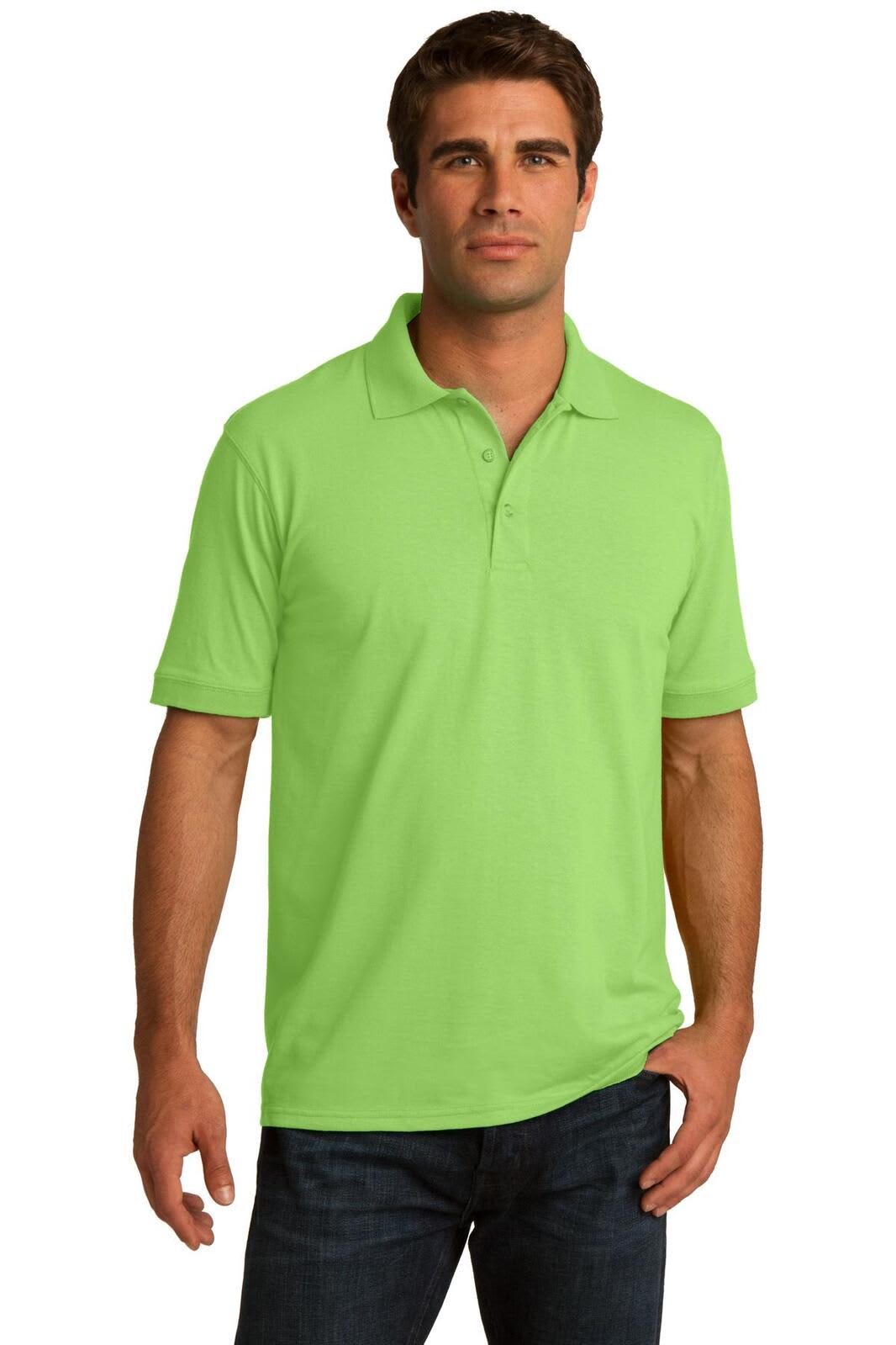A man wearing a bright green polo shirt stands confidently, featuring a collar and short sleeves. The shirt has a logo.