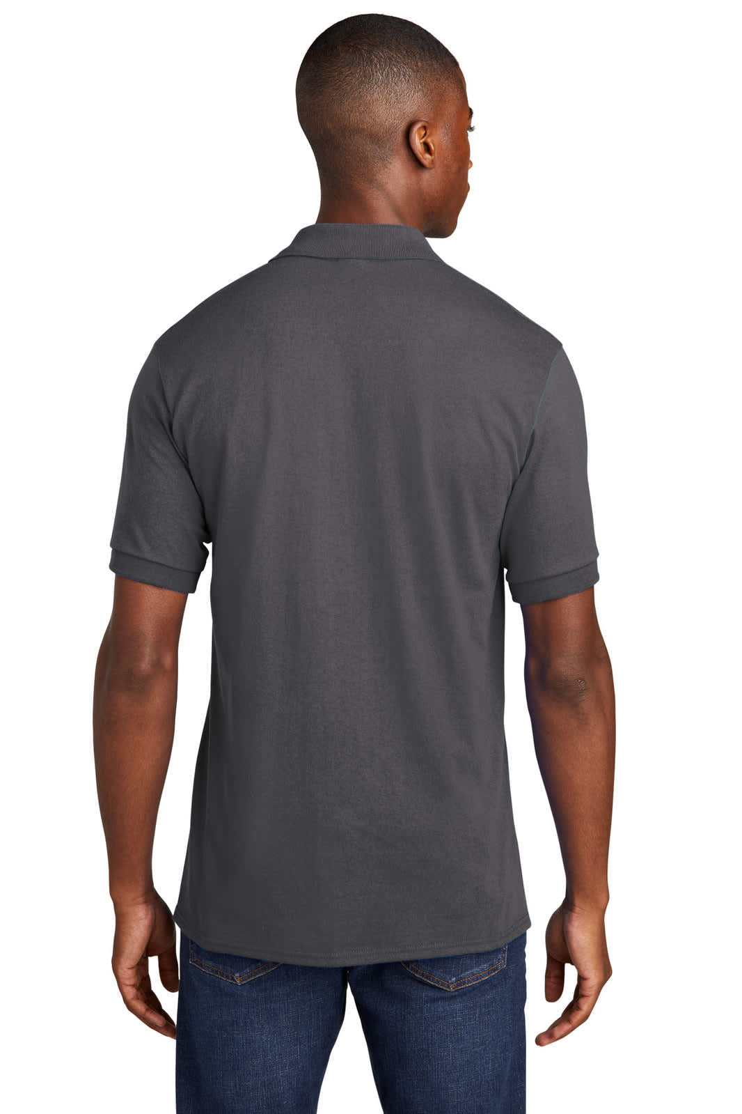 A grey polo shirt from Port & Company with a pocket, displayed from the back without visible logos.