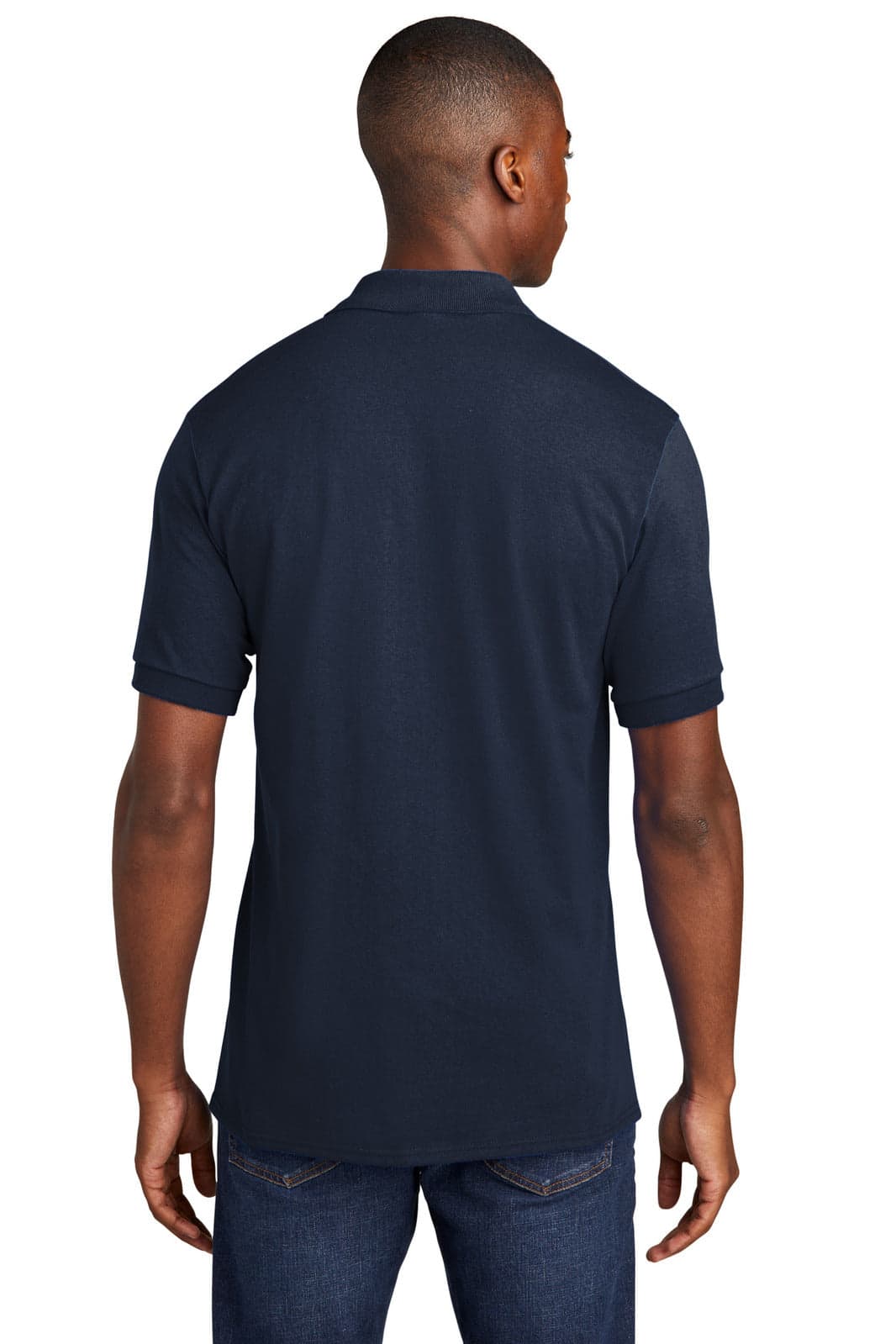 A navy blue polo shirt featuring a pocket and a logo, shown from the back on a model.