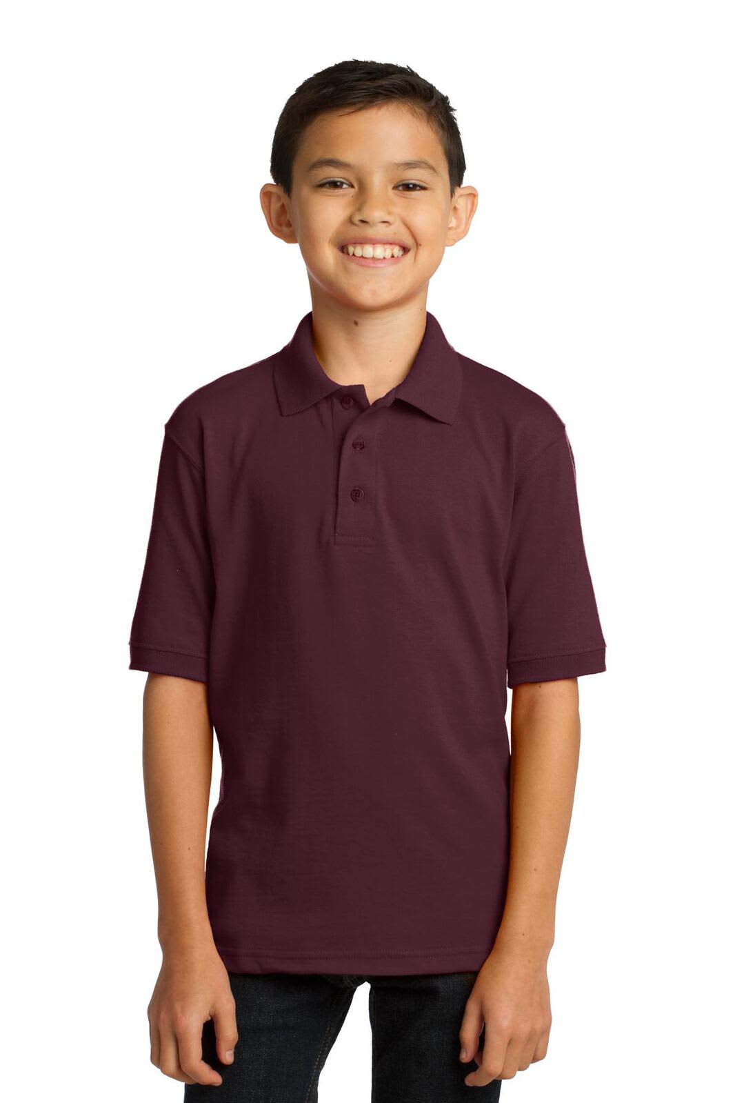 A boy wearing a maroon youth polo shirt with short sleeves, featuring a collar and a logo.