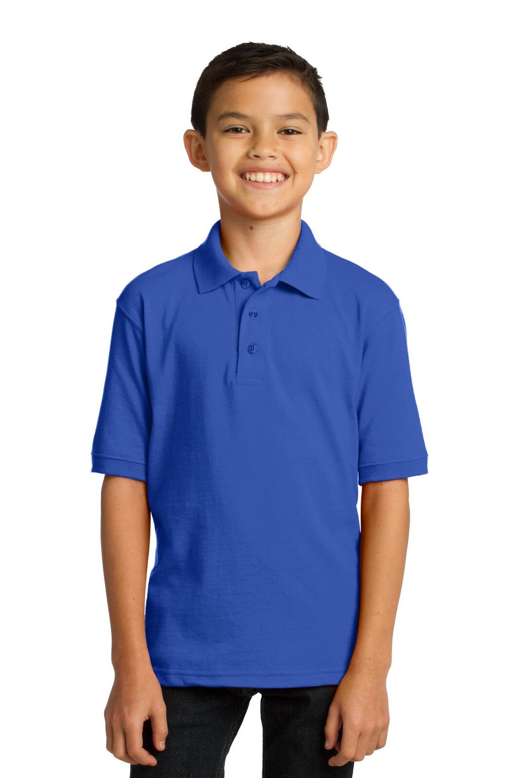 A youth in a bright blue polo shirt, featuring a classic collar and short sleeves, standing with a cheerful expression.
