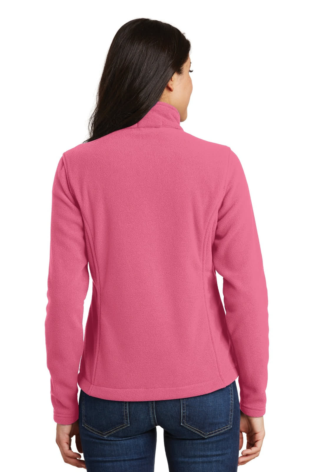 A pink fleece jacket with a high collar, featuring a logo, worn by a woman from the back.