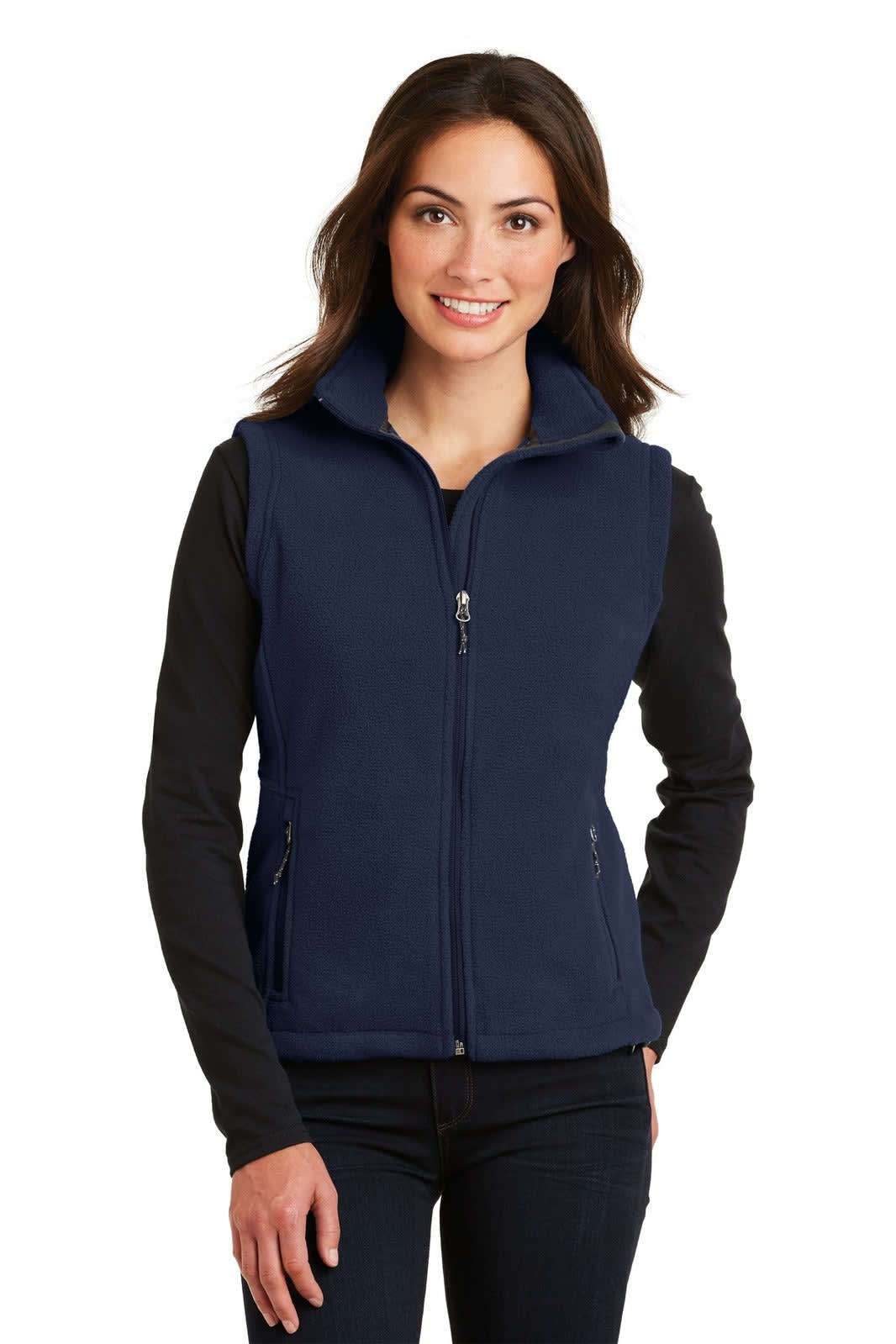 A navy fleece vest with a zip front, featuring a high collar and two side pockets, worn over a long-sleeve top.