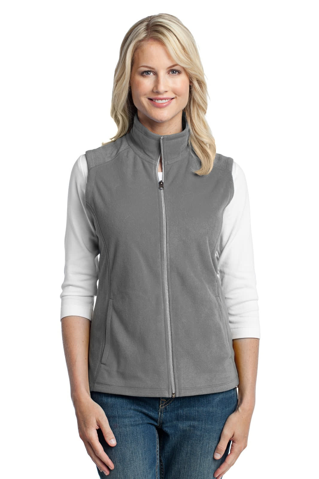 A grey microfleece vest for ladies, featuring a zip front and a branding logo, worn over a white long-sleeve top.