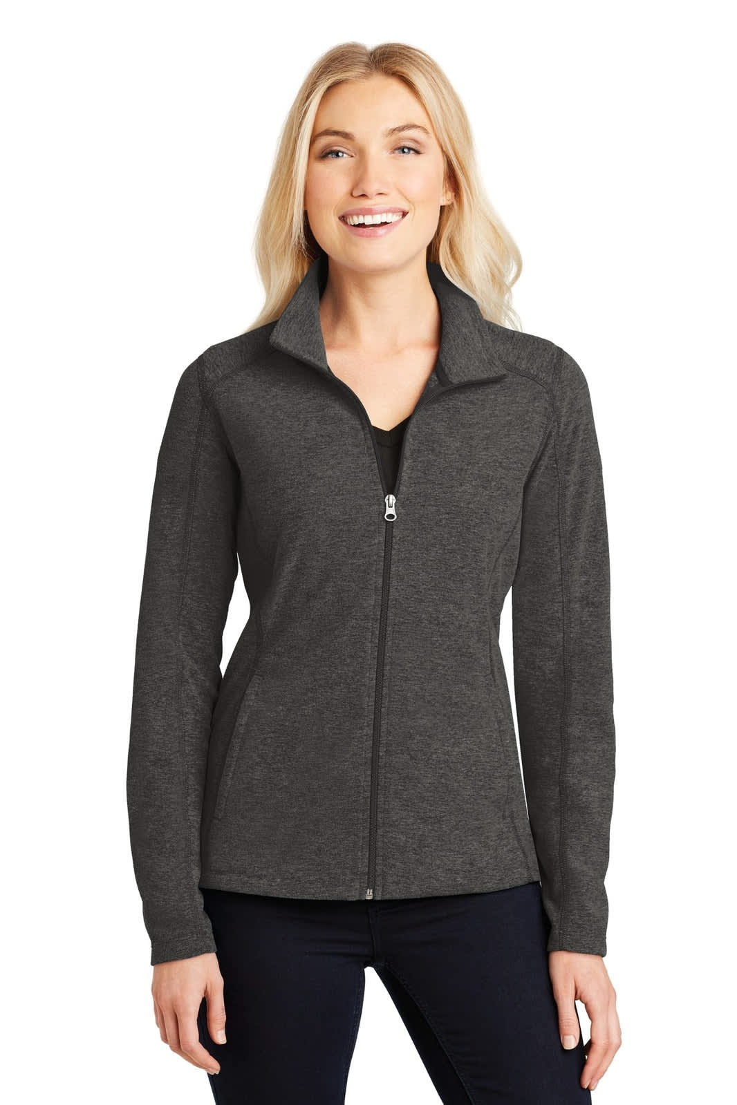 A grey microfleece full-zip jacket with a zippered front and collar, worn by a woman smiling.