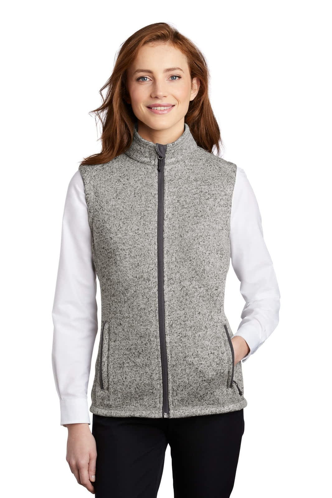 A grey ladies' sweater fleece vest with a zip front and side pockets, worn over a white long-sleeve top.