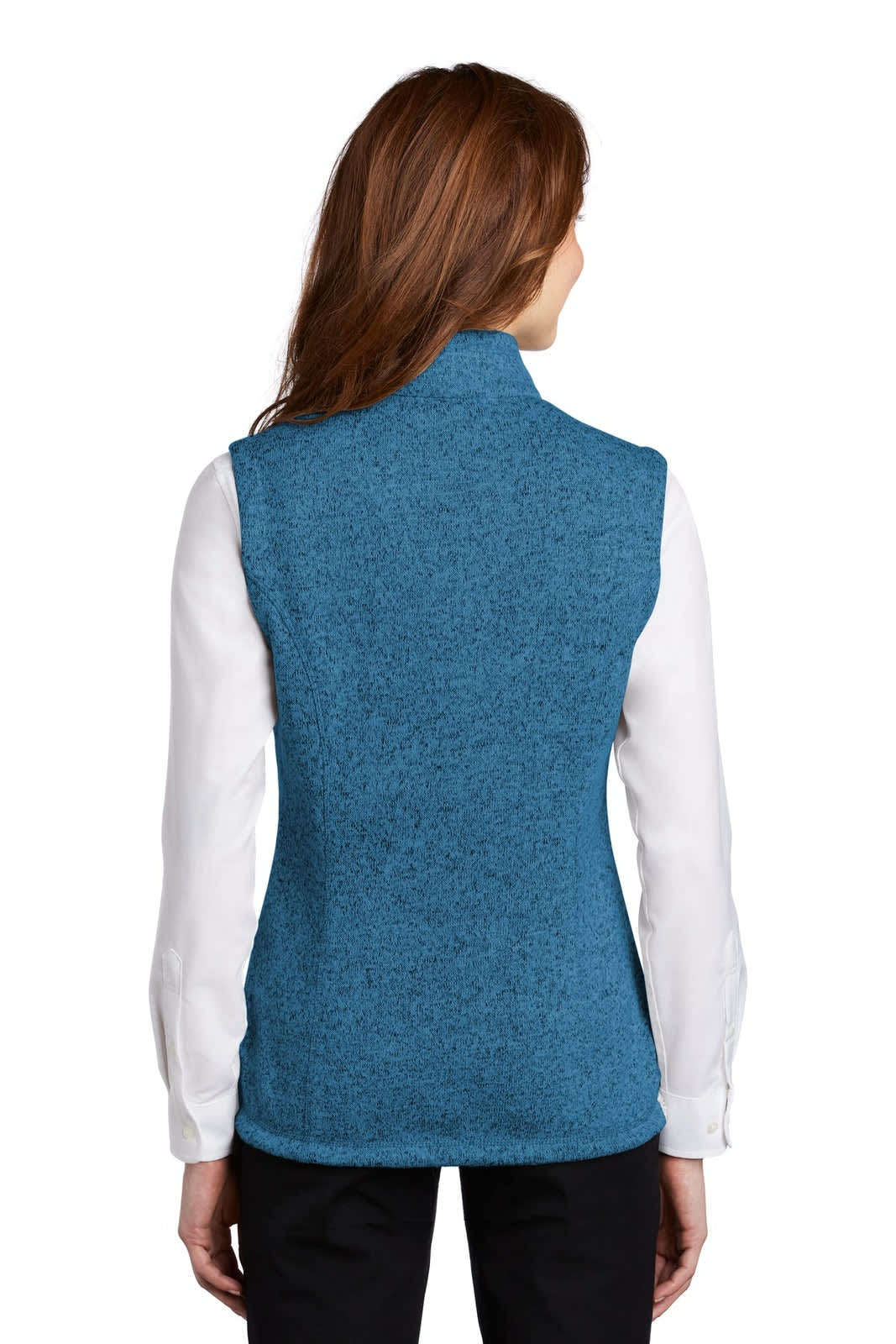 A blue fleece vest features a high collar and a slim fit, worn over a white long-sleeve shirt.
