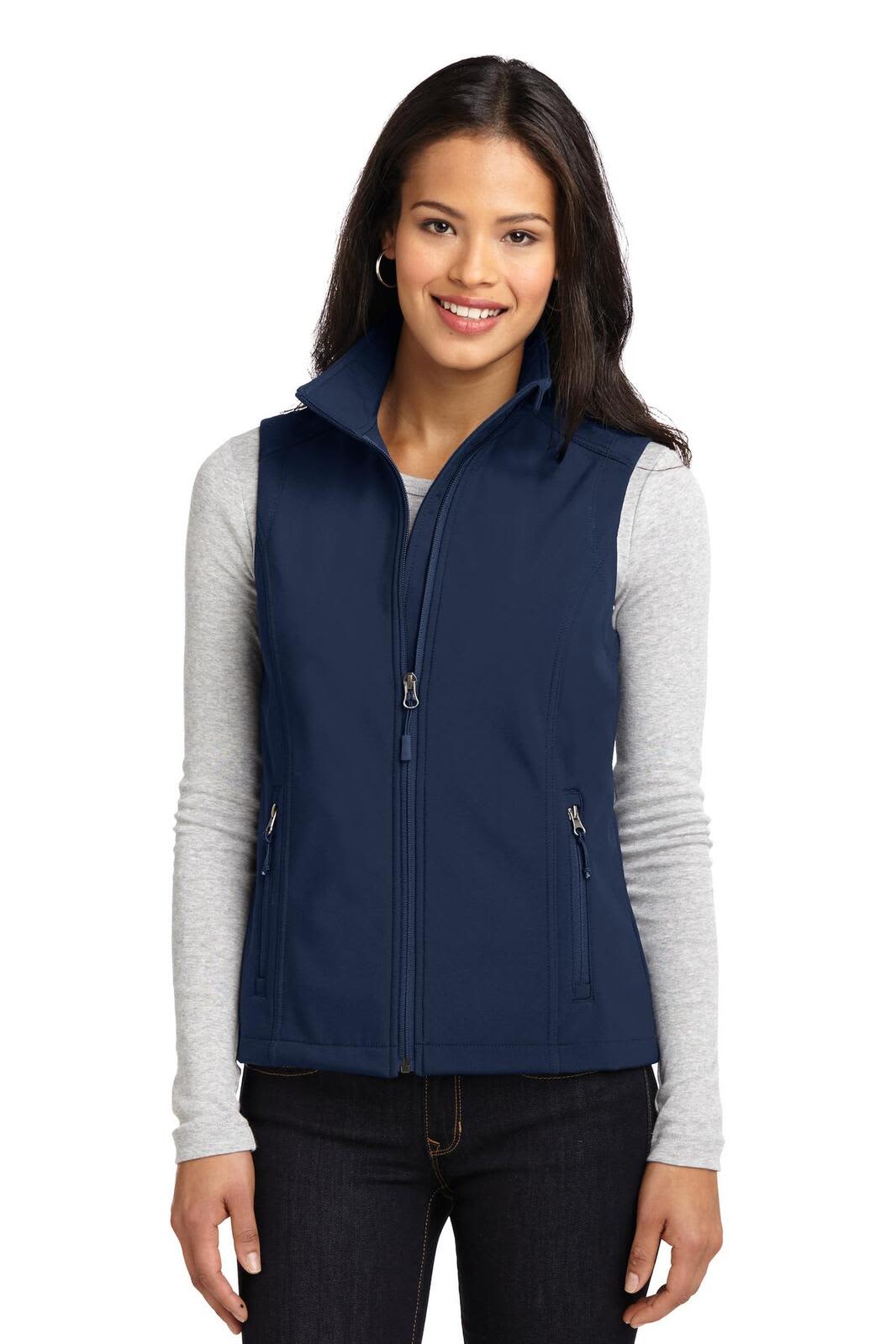 A navy soft shell vest featuring a high collar and zippered front, worn over a grey long-sleeve top.